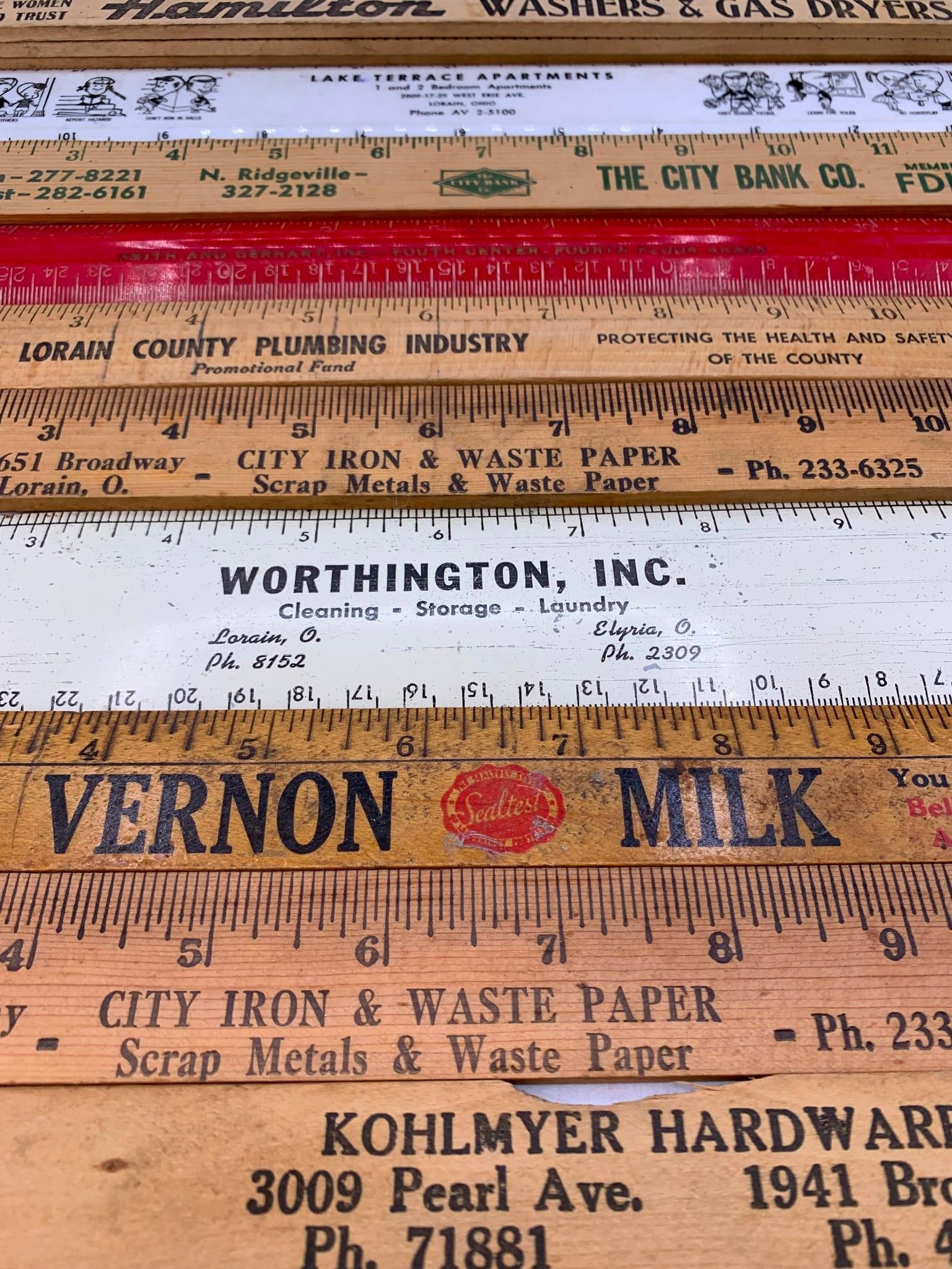 15 Vintage 3 Foot Slide, Zig Zag, and 12 inch Advertising Rulers and Yard Stick Measuring Rods: Early advertising graphics, one old Kohlmyer Hardwares paint stick in the mix, 12 wood, 1 metal and two plastic. 