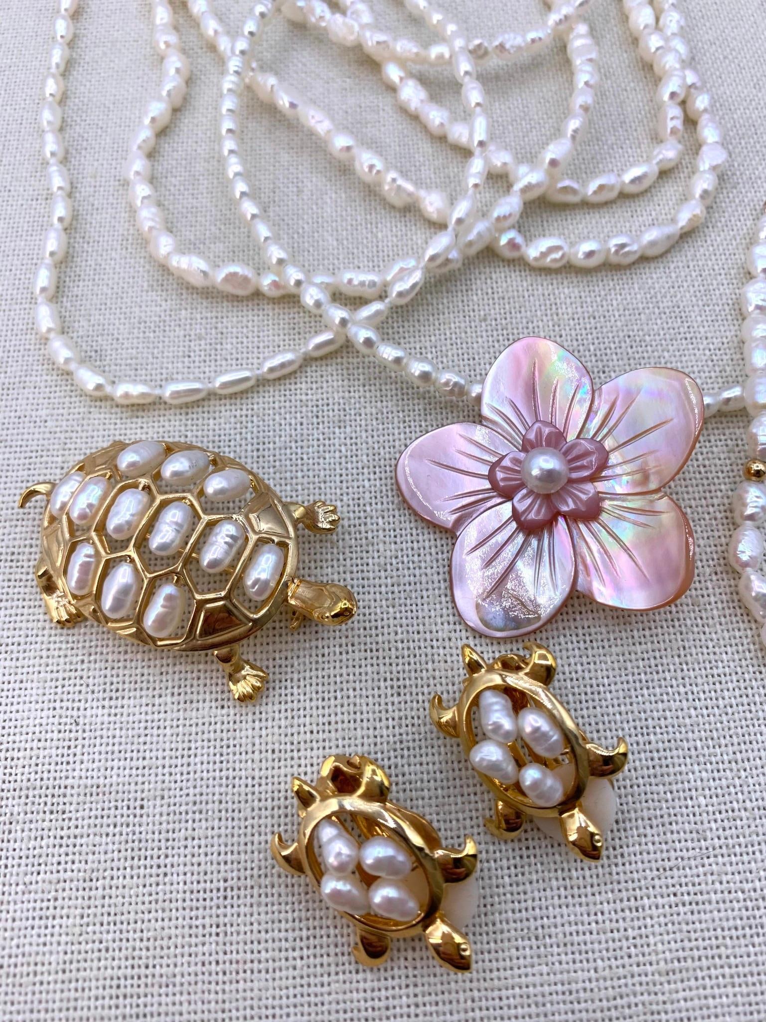 13 pc 14k Gold, 925, Freshwater Pearl Jewelry Collection: * 925 hallmark on the carved blush mother of pearl floral pendant with freshwater pearl center, 1 1/2"* 14k hallmark on the freshwater pearl and gold bead 7 3/8" length bracelet* 16" lengt