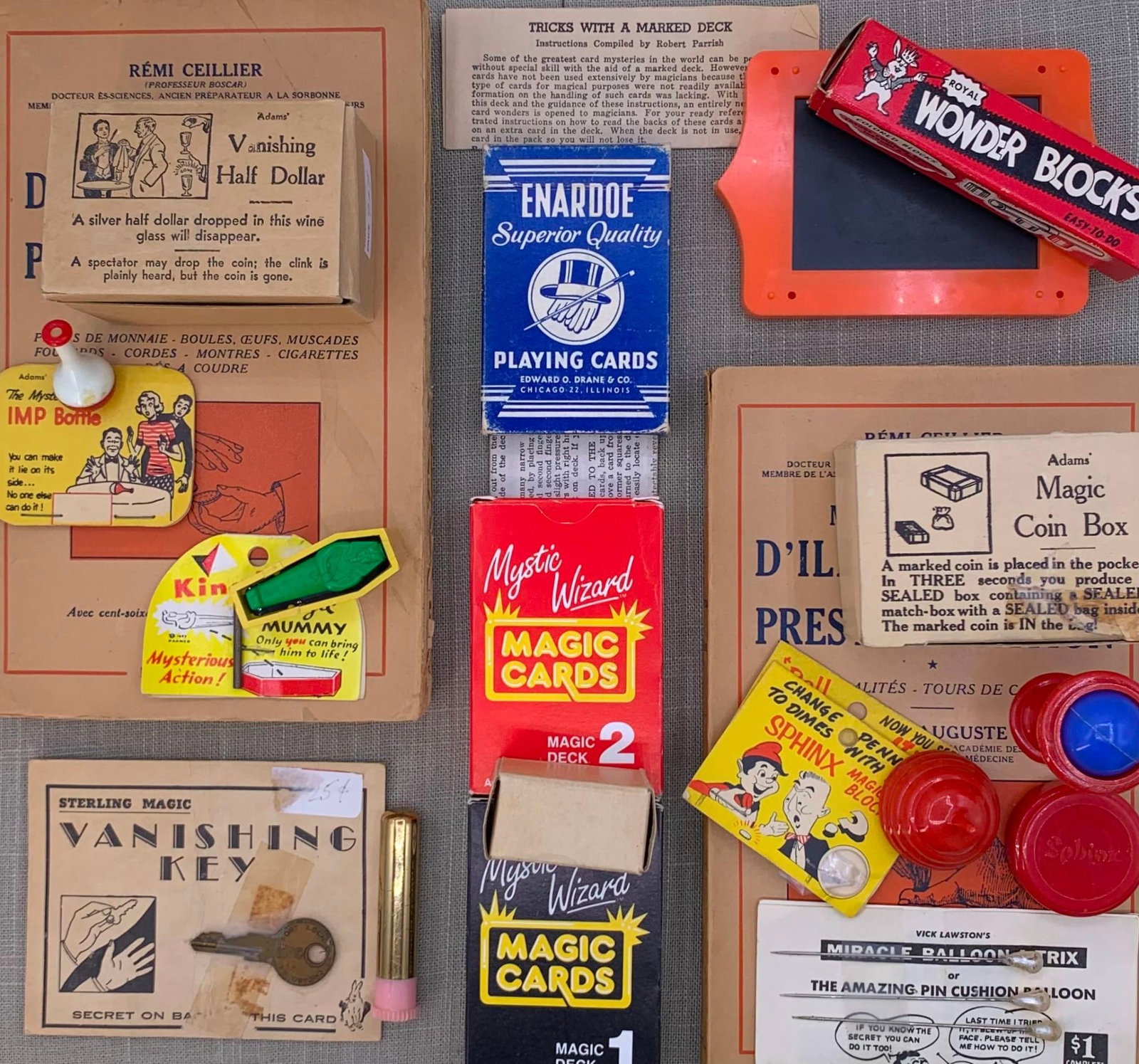 Vintage Mid Century Magic Illusion Tricks & 1950s French Magician Books Collection: Pair of 1953 French magic books and assorted vintage tricks, including instructions with many of the pieces along with a few photo copies from a 1940s magic book. 