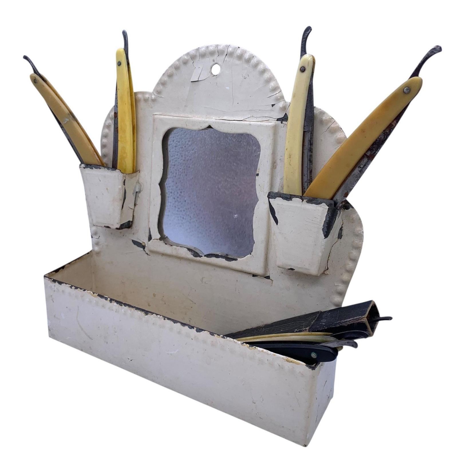 Antique Chippy Cream Metal Hanging Shaving Mirror & 7 Antique Straight Razors: 8 3/4" x 9" x 2 3/4", embossed edge with areas of paint loss to the metal, 1 bone handled razor with the remainder celluloid, some oxidation to the metal, sharp edges.