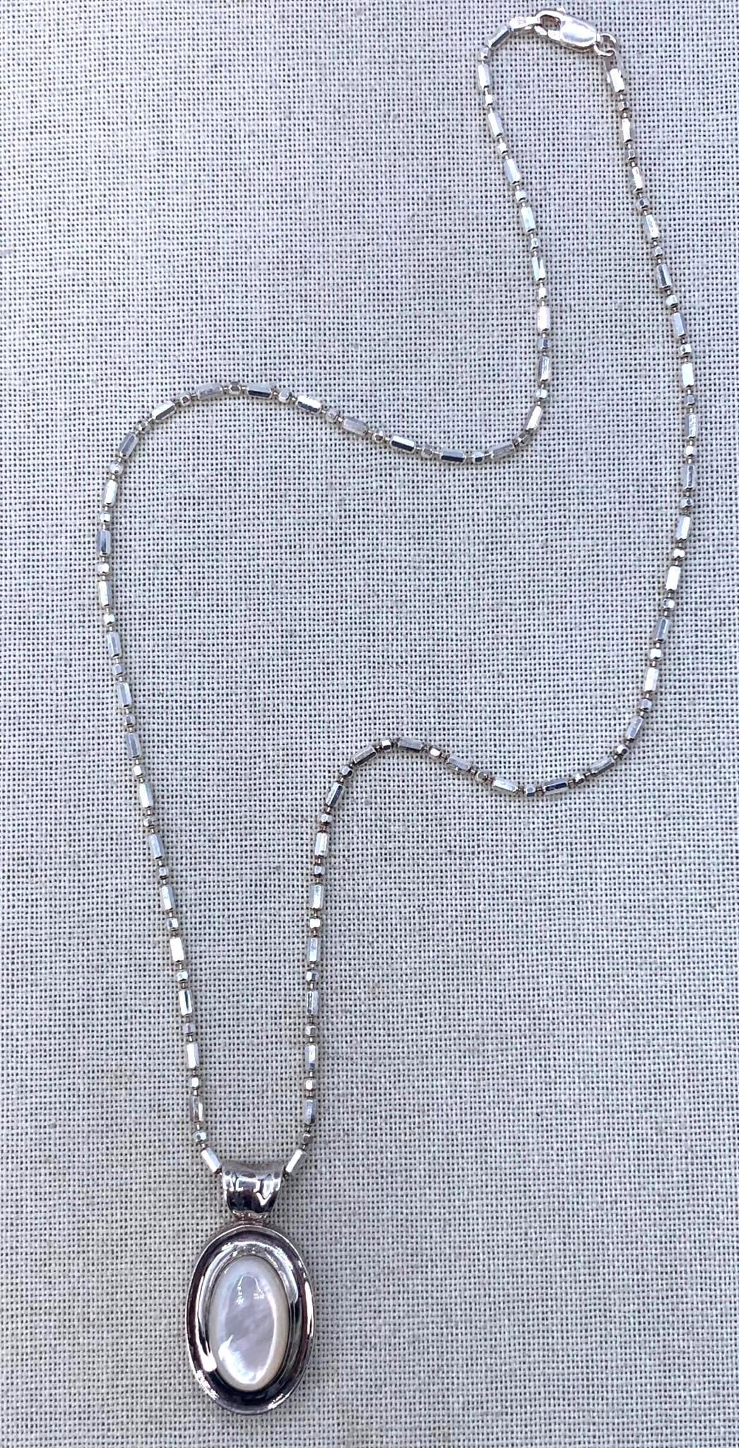 Luminous Sterling Silver Mother of Pearl Pendant on Italian Bar & Bead 925 Chain: 15.2 gram combined weight, 925 Made in Italy hallmark on the 20" circumference chain, 1 1/2" length MOP Sterling pendant with 925 hallmark.