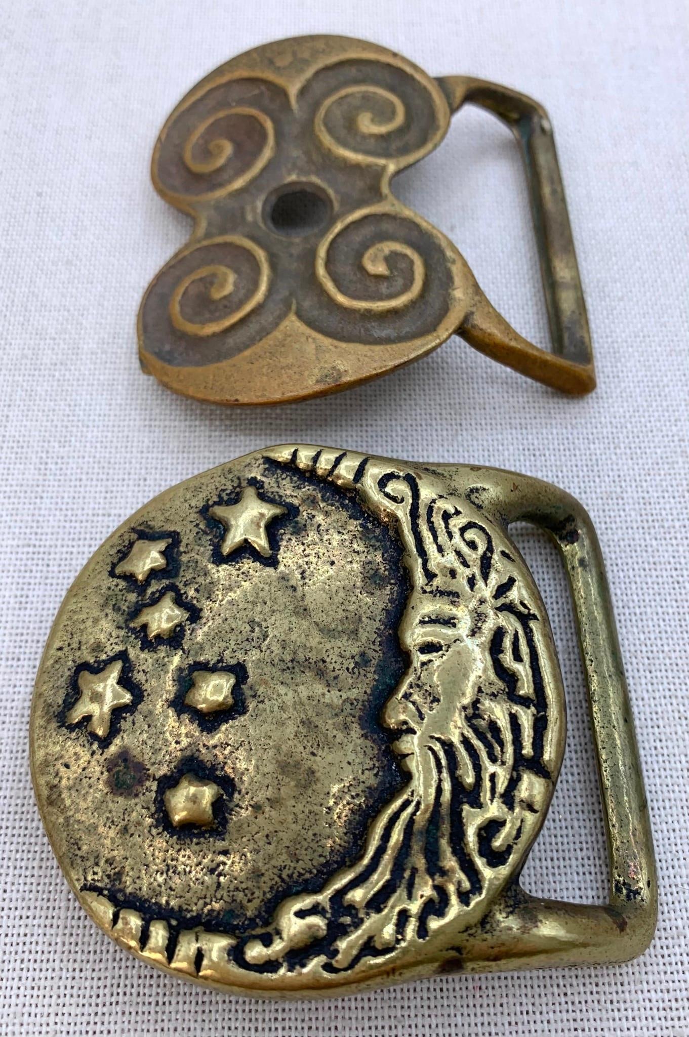 Pair 1970s Celestial Hippie D Laurie USA Embossed Brass Belt Buckles: * Solid Brass stamp on the rear, crescent moon and stars detailing, 2 7/8" x 2 1/2"* c1972 D Laurie USA Solid Brass Star stamps, 2 3/4" x 2 5/8"