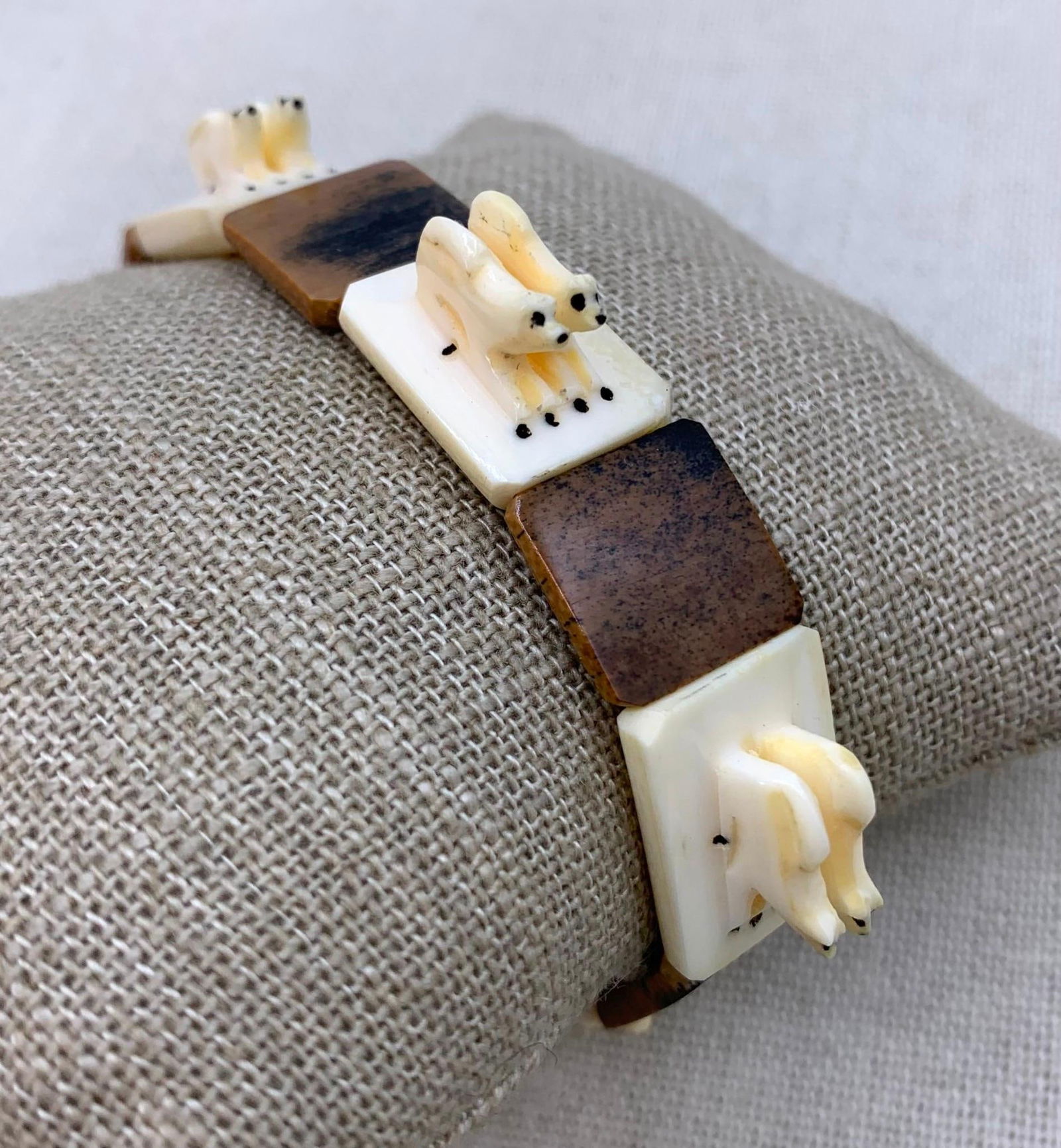 Vintage Hand Carved Alaskan Inuit Dog Sled Indigenous Made Fetish Stretch Panel Bracelet: Hand carved Natural material, cord foundation remains stretchy, 2 7/8" wrist width Unstretched, panels are approx. 1/2" wide x 1/2"-5/8" length.