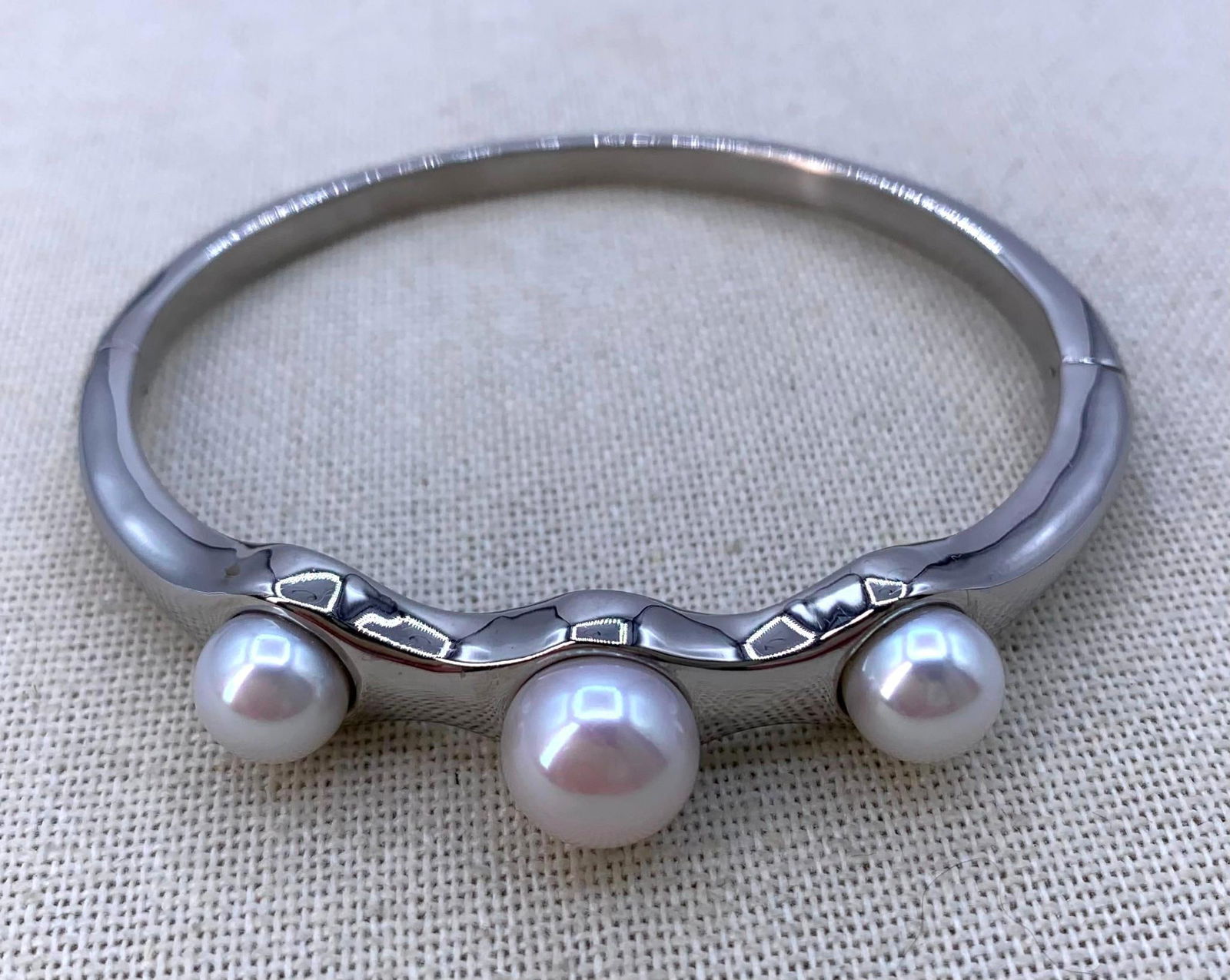 Glorious Freshwater Pearl Stainless Steel Hinged Bangle Bracelet: Trio of gleaming freshwater pearls 10.5mm to 8.5mm in size, Stainless Steel framework, functioning hinge with magnetic quick closure and safety clasp, 2 3/8" interior wrist width