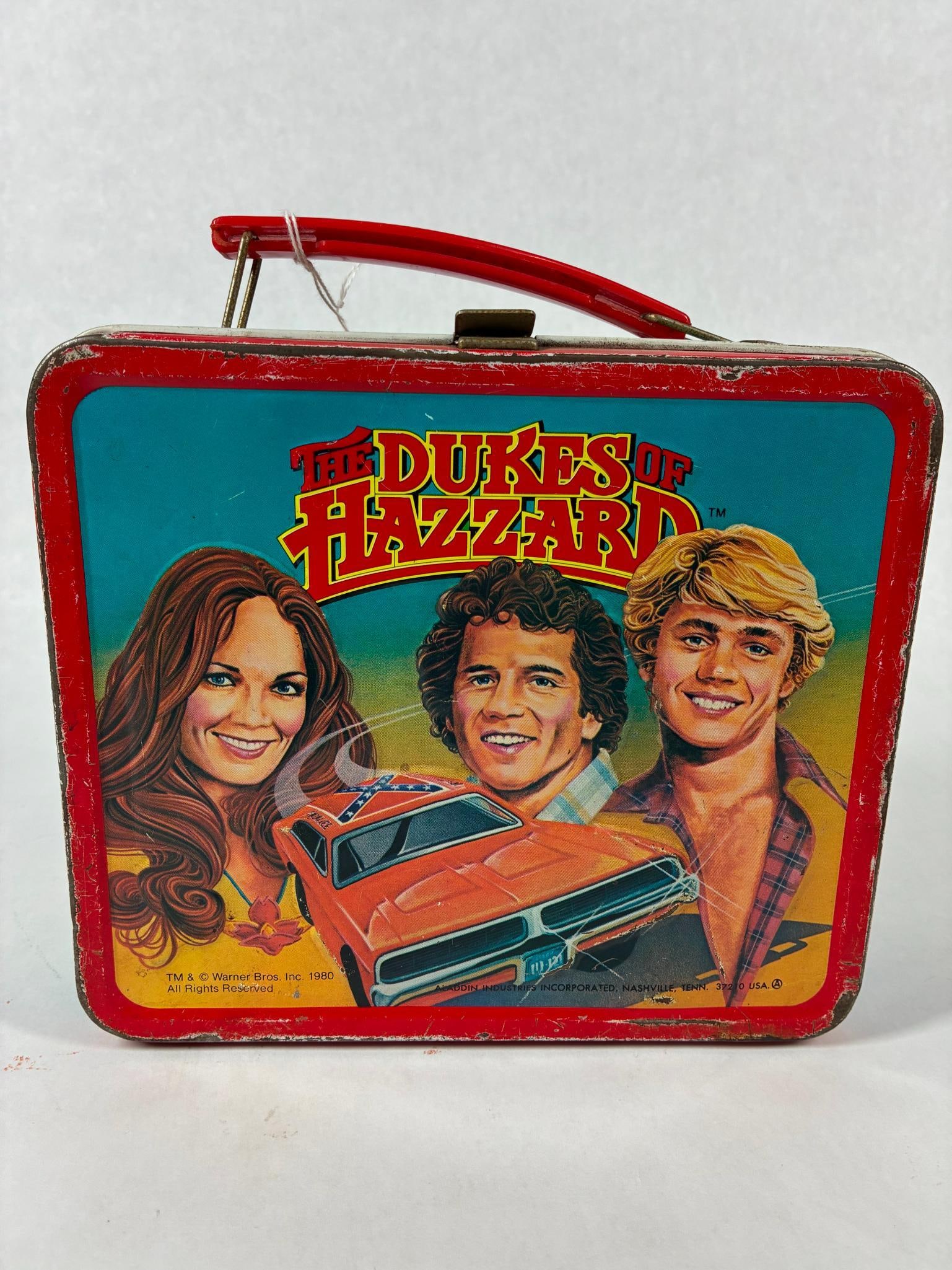 The Dukes of Hazzard Lunch Box and Thermos: Dated 1980. Wear along edge and to thermos shows.