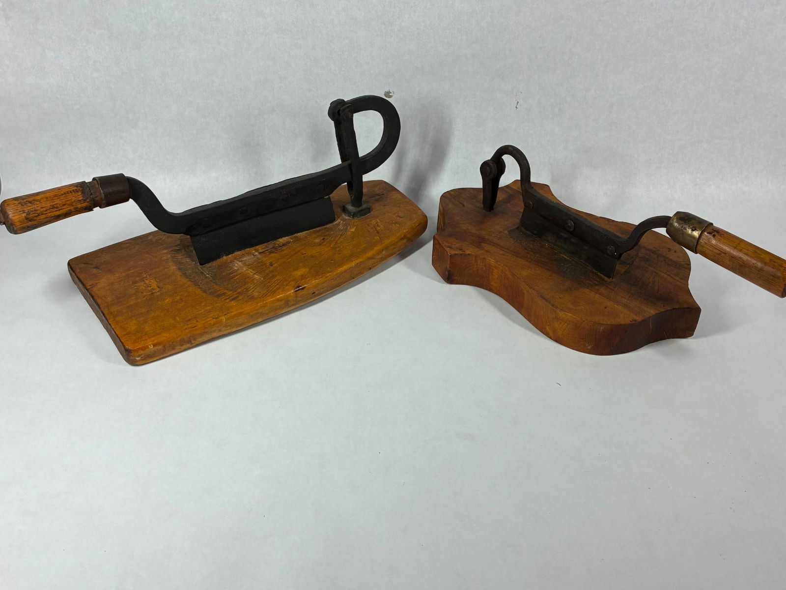 Wonderful Pair of Early Tobacco Choppers: Each with a thick slab wood and cast iron blade. Shield and oval board shapes. Both are in good primitive condition