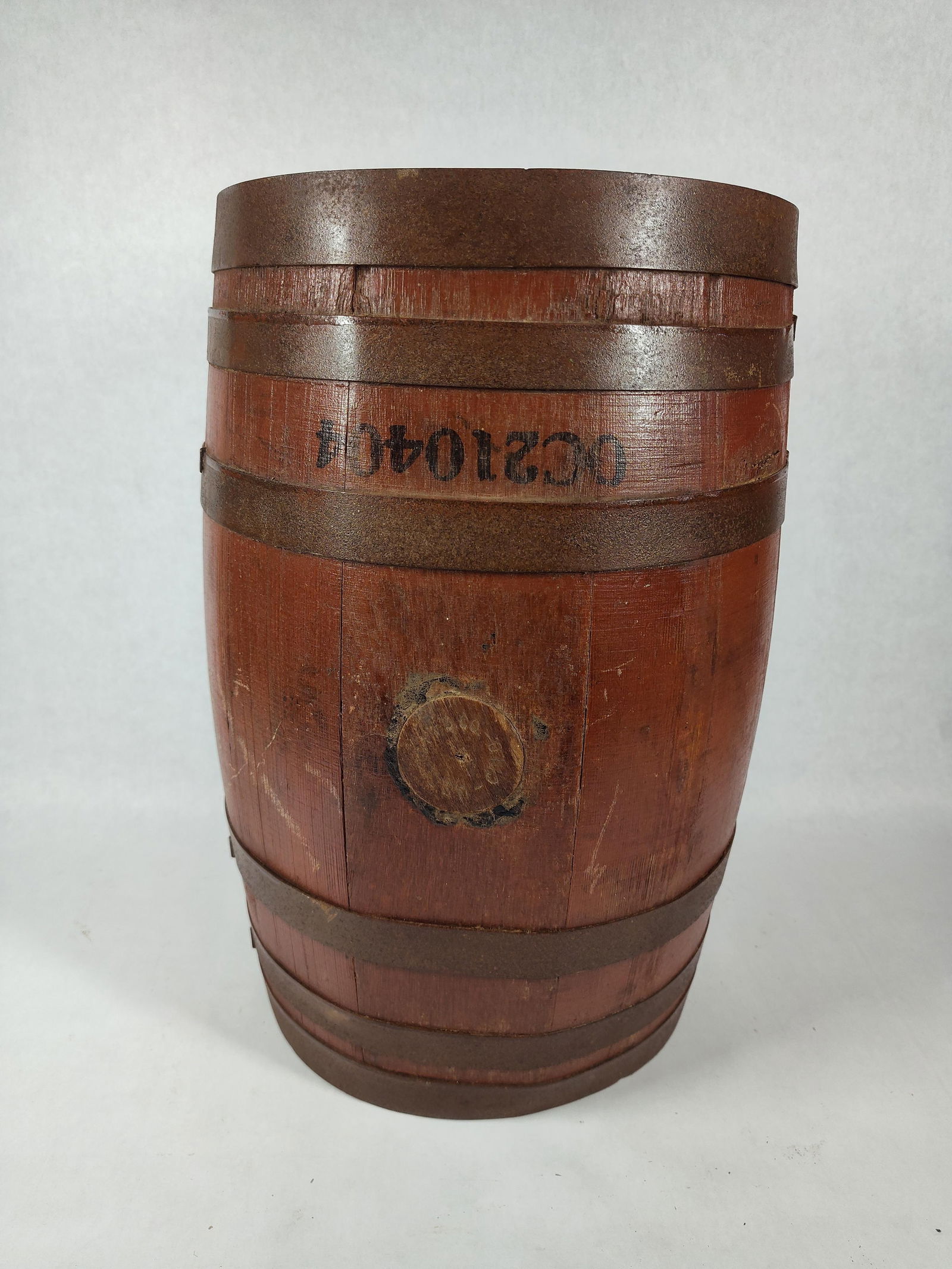Coca Cola Wooden Syrup Barrel: Original paper label shows to top although it is only a partial. Bung stopper reads Cinn, Ohio. Barrel numbered OC210404. 17 inches tall x 10.5