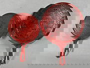 Griswold Red Enamel Skillets # 5 and #8: Both small block logo, Erie Pa. Showing sediment and scuffs to inside. Skillets are solid with no cracks. Enamel shows a few chips.