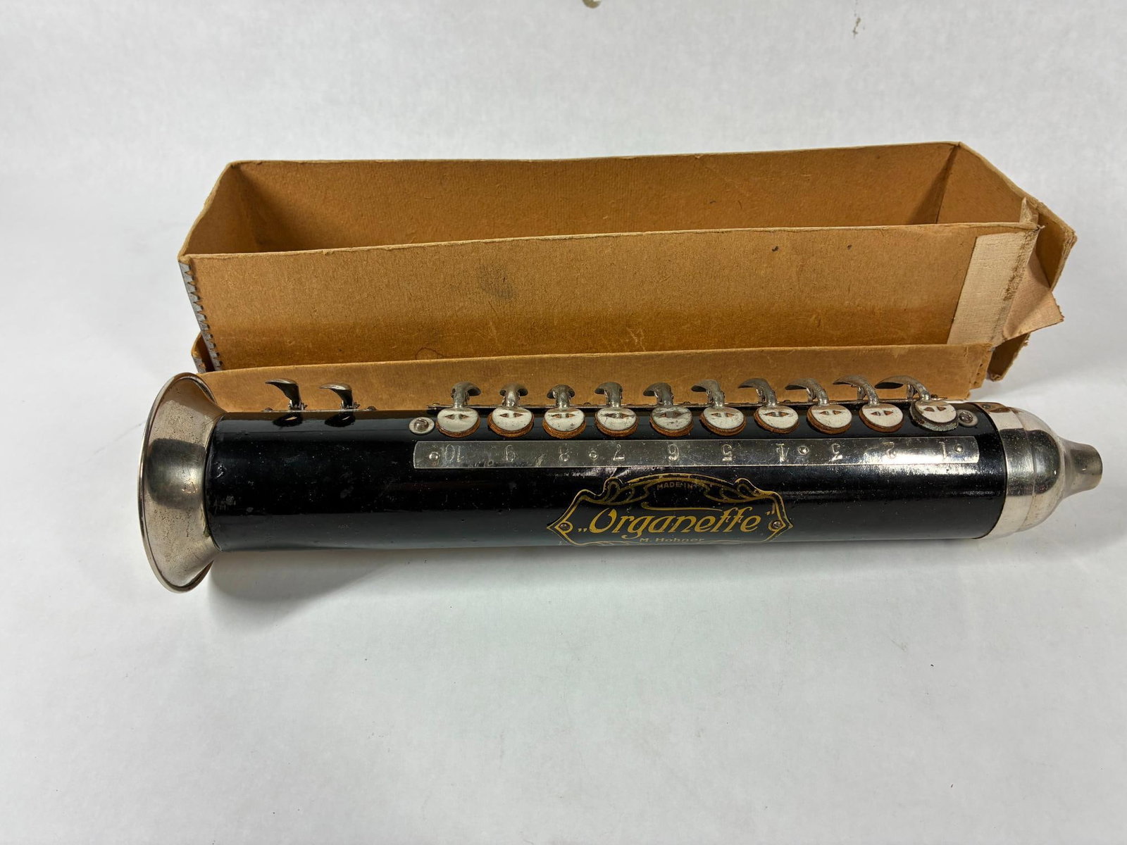 The Organette by Hohner: A wonderfully early musical instrument. In original box with music and instructions. Good condition.