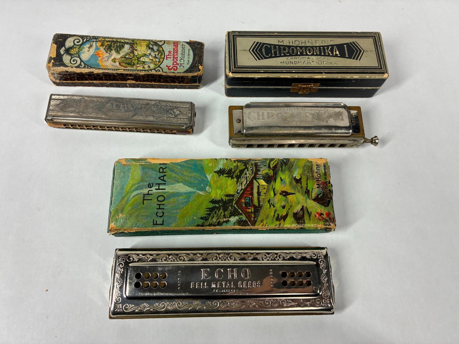 M Hohner Harmonicas: Each in original box. Chromonika, The Sportsman, and The Each Harp.