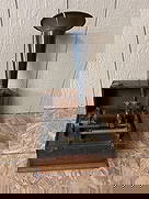 Thomas Edison Standard Phonograph: In dovetailed case with horn. Several cracks are shown to parts including the sound wheel and metal horn. No handle is included.