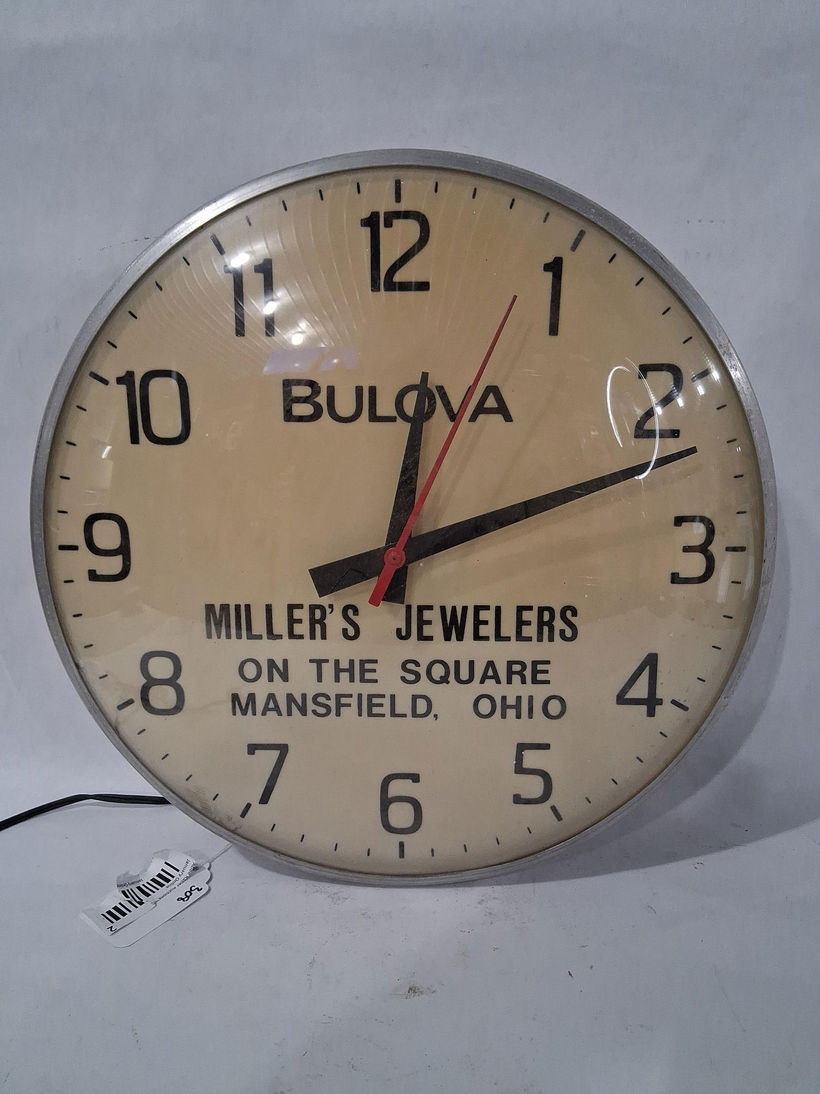 Millers Jewelers Mansfield Ohio Clock: Bulova brand. glass bubble face. 15 inch diameter. In good working condition