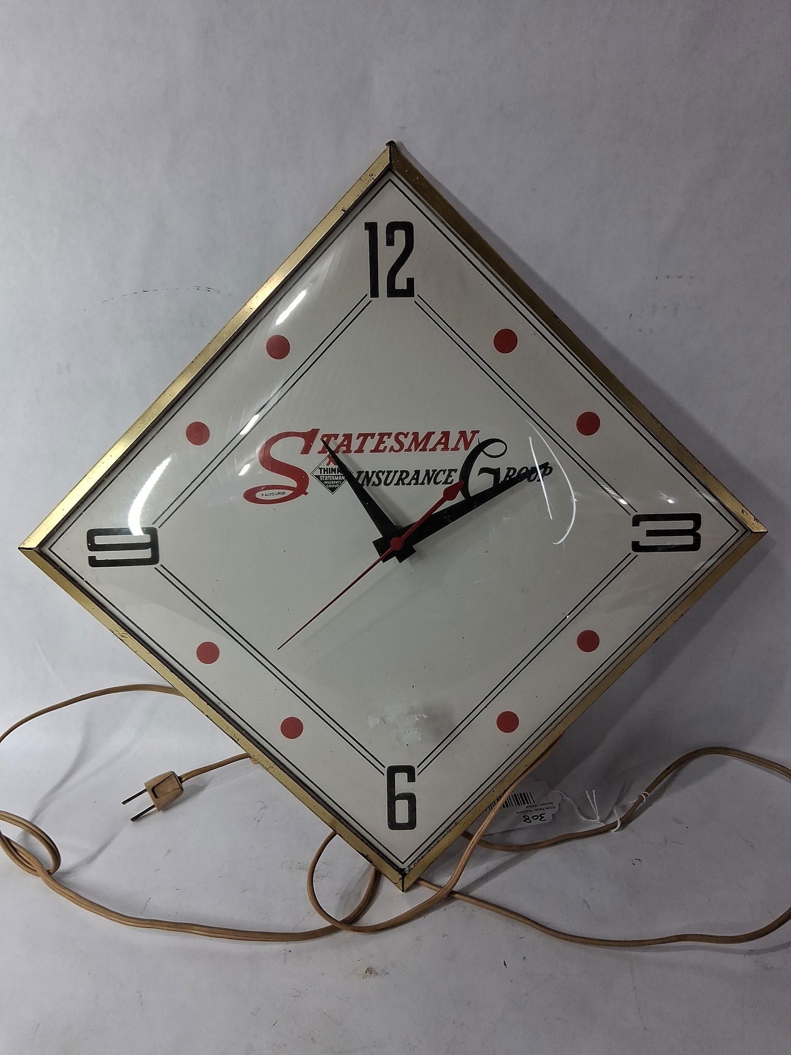 Statesman Insurance Advertising Pam Clock: A Pam original with glass face. 17x12. Working condition 