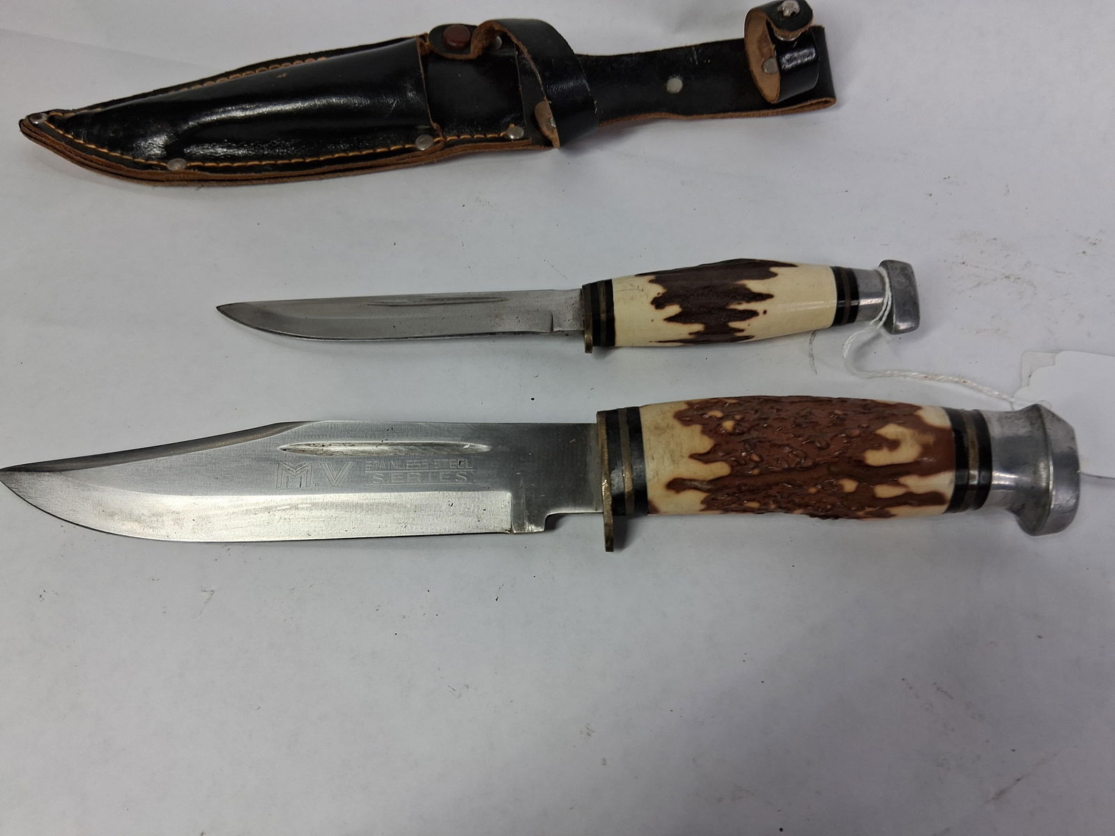 MV Stainless Steel Series Natural Handle Fixed Blade Knife Set w/ Double Leather Sheath: 4 and 5.5 in. Blades both in good early condition with sheath being fully intact?