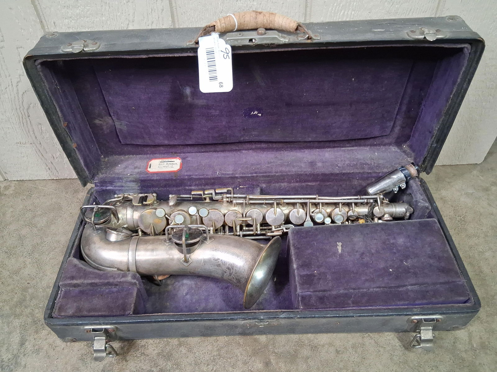 American Standard High Grade Brass Saxaphone: Made by Cleveland Music Instrument Co. Good condition but shows some patina, included is mouth piece, and neck strap. In felt lined case. 