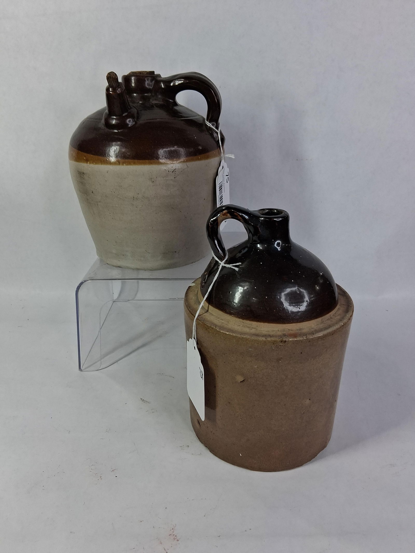 Stoneware Whiskey / Moonshine 2 Toned Crock Jugs: Great overall condition with minor areas of wear and condition issues to each due to age and usage? 8 and 9 in H?