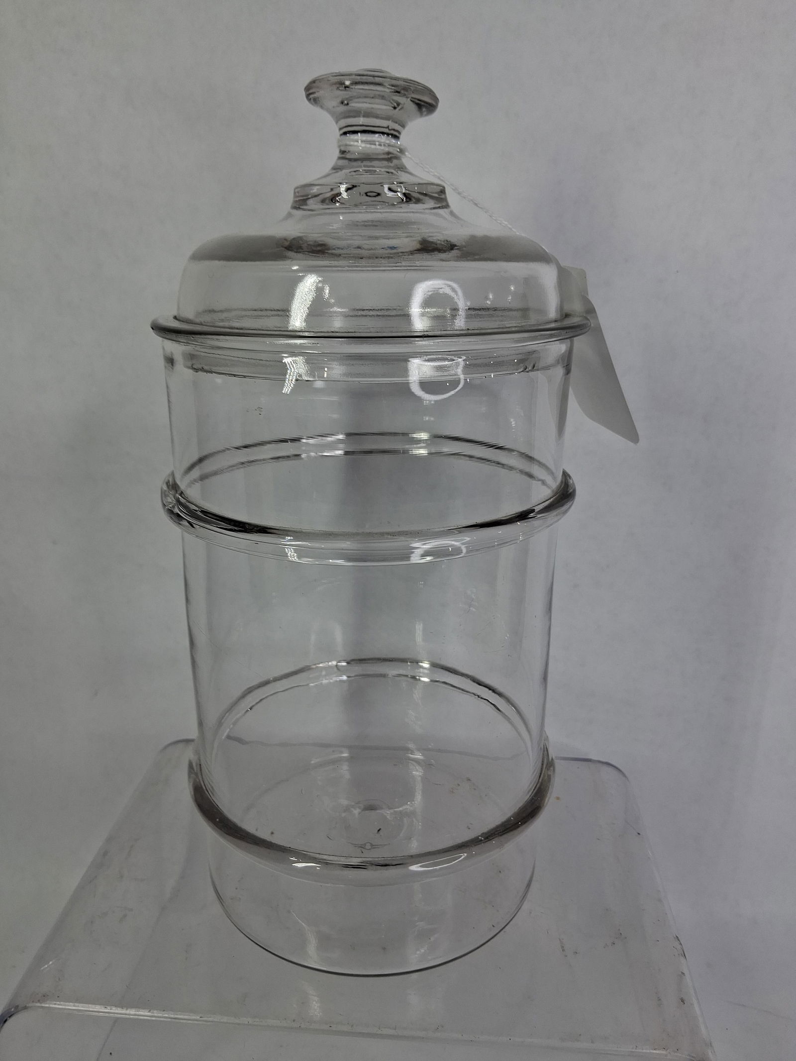 Older Pharmacy/ Apothecary Jar: Ribbed sides and hand blown, see botton pontil. No cracks found but a few flea bites show around lip of lid. 