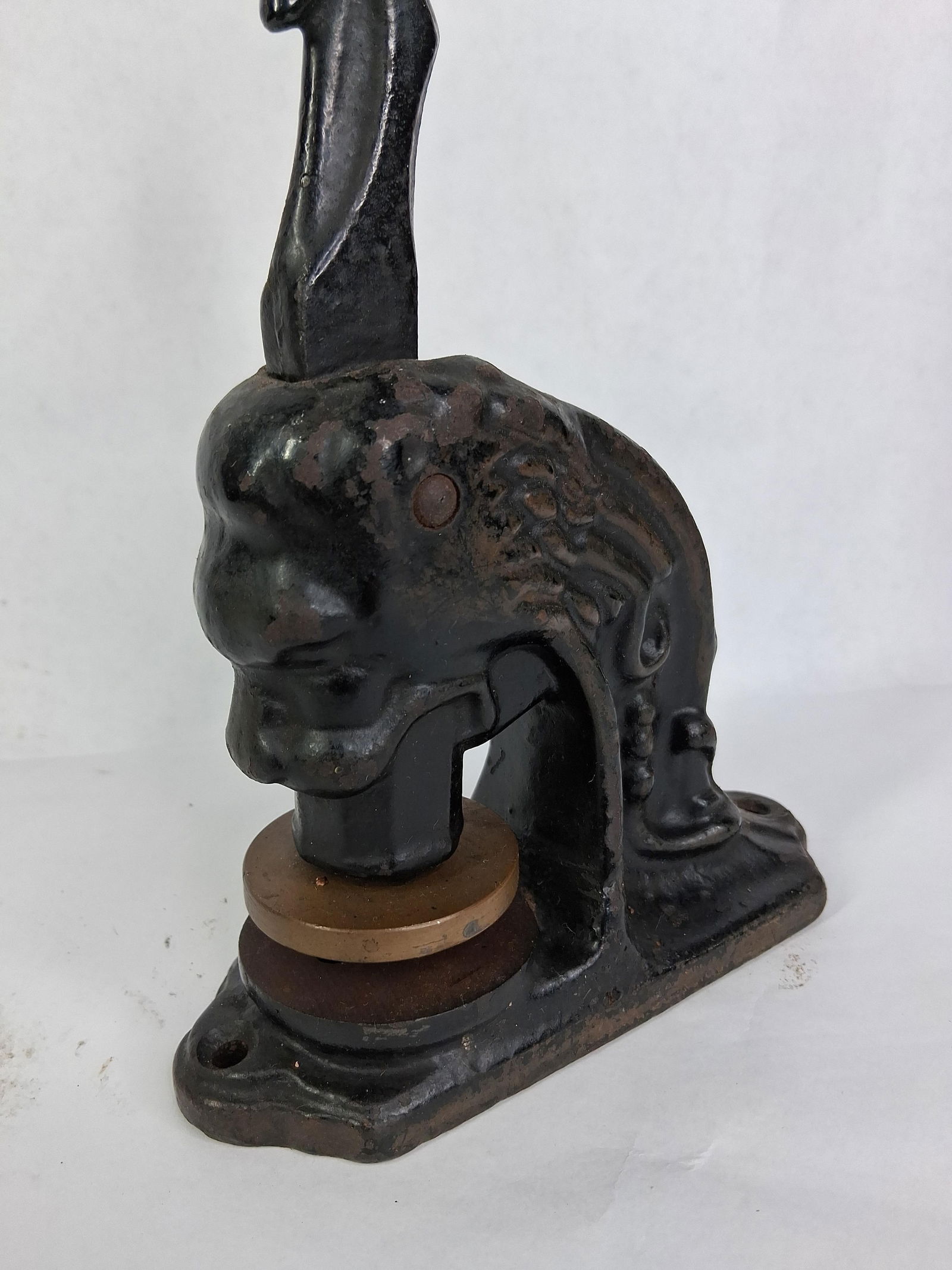 Lions Head Buffalo NY Stamp: Handle presses down, Appears to have an early 1900s date. 11 inches tall 