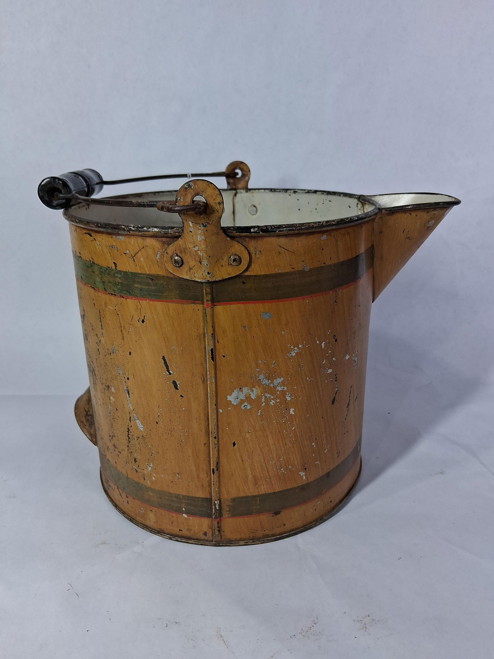 Tin Cream Pail: Wood grain painted exterior with large spout and handle.8 x 8.5. Several small hits with paint loss. 
