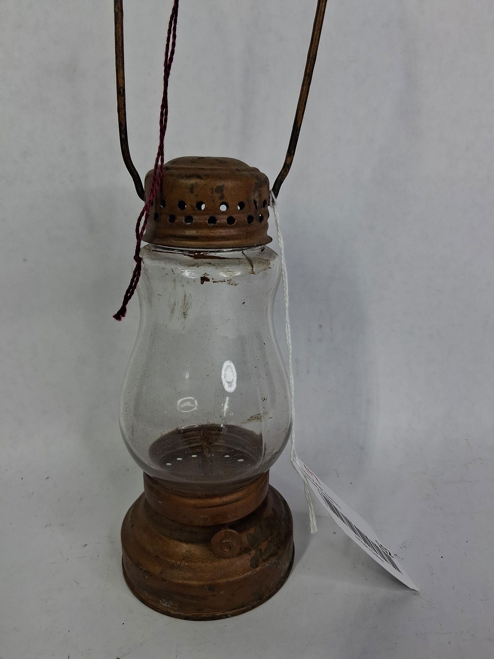 Early Wick Burner Skaters Lantern: Good condition with gold tone paint and glass globe. 7 inches tall