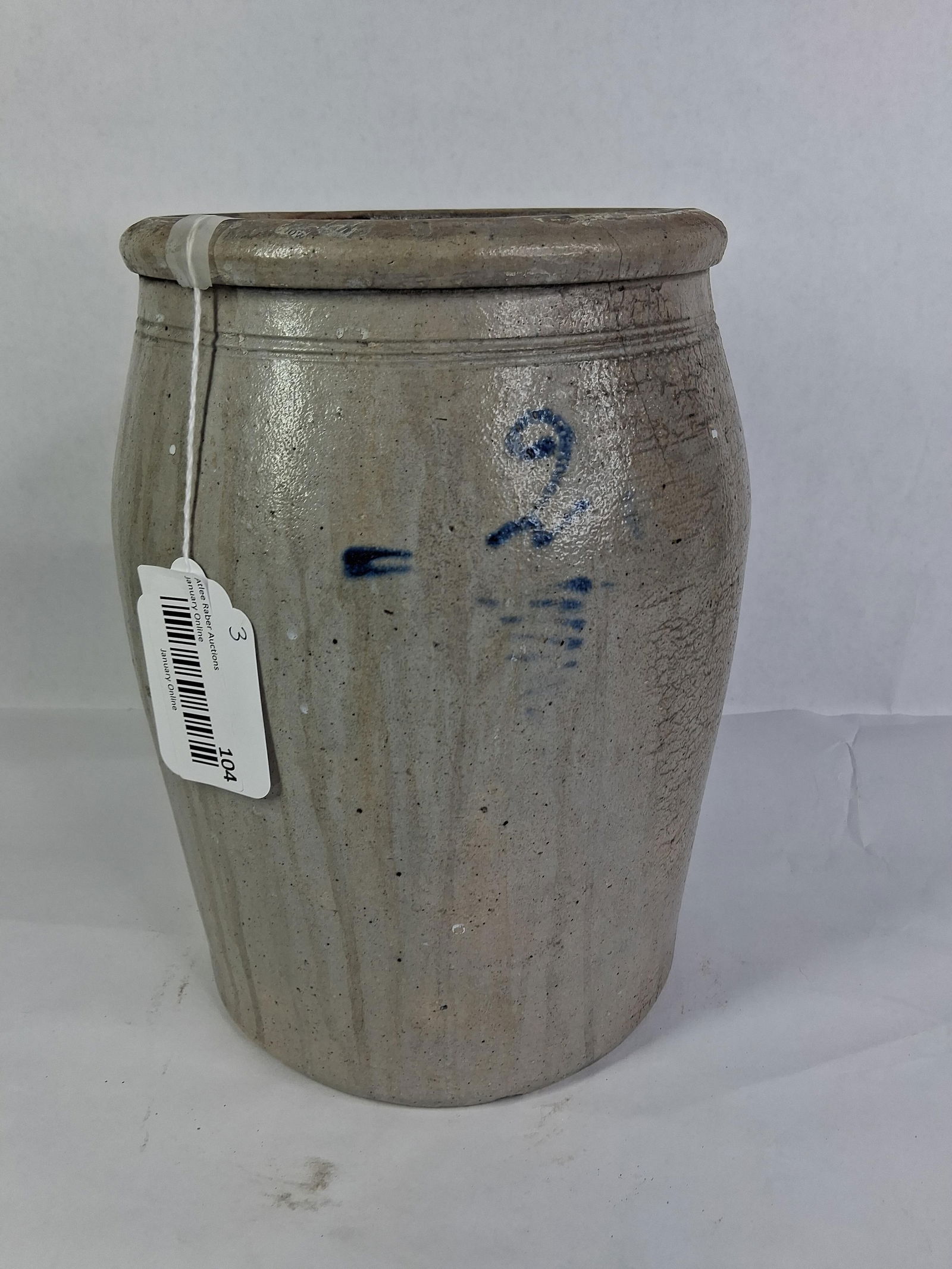 2 Gallon Stoneware Jar: Cobalt blue design. Some crazing to glaze and a hairline crack. 11 inches tall. 