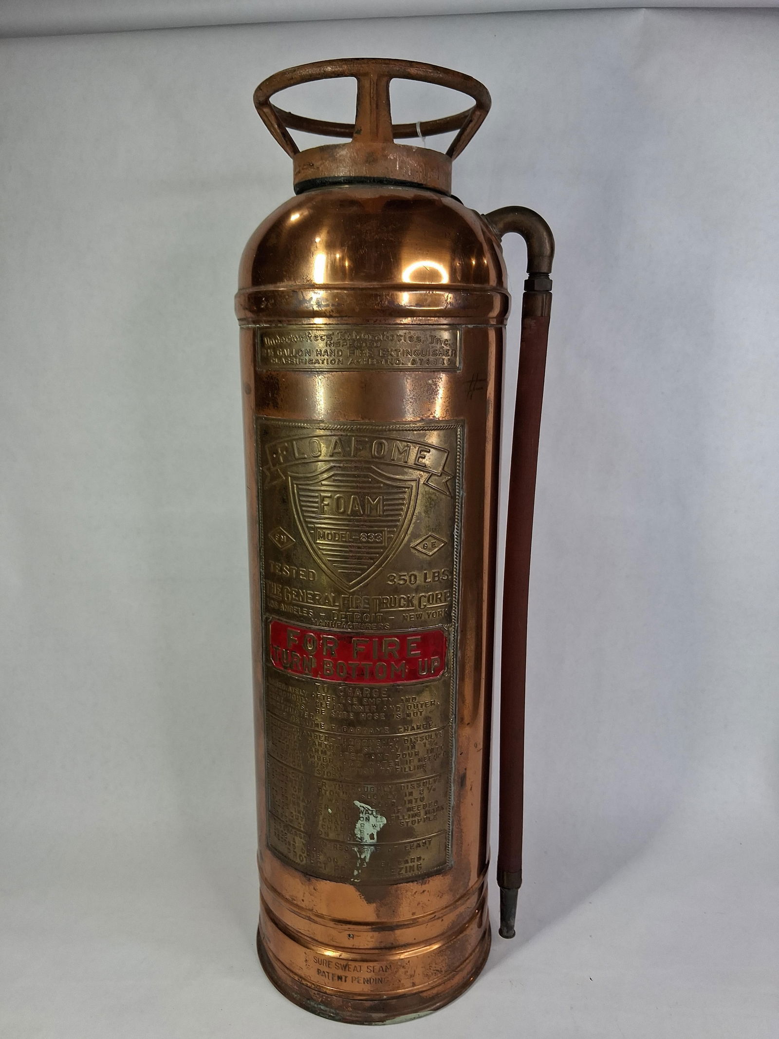 Flo A Fome Brass Fire Extinguisher: Includes rubber hose. Good condition with no large dents of scratches. 24 inches tall