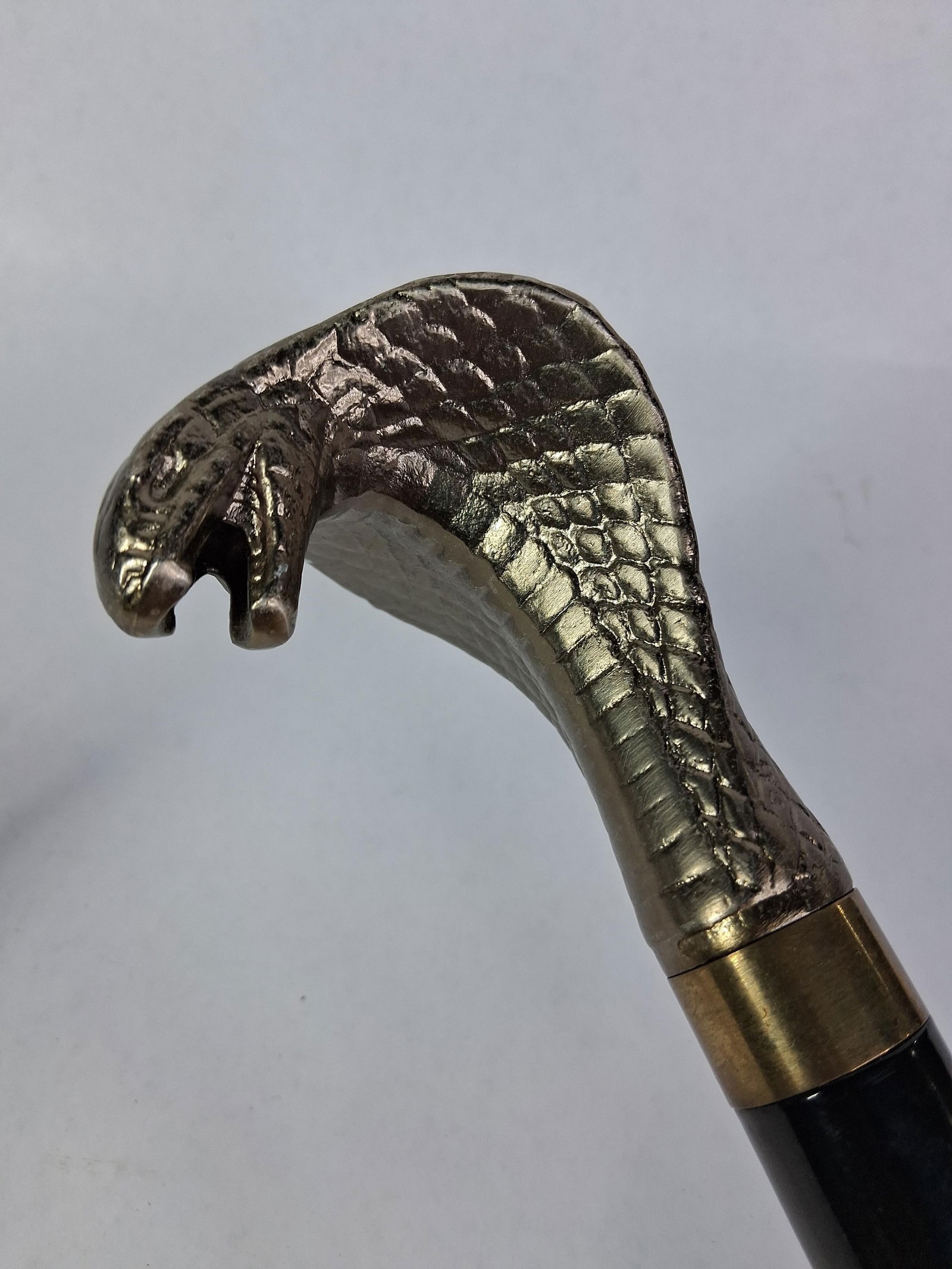 Cobra Head Sword Cane: This Cobra head handle cane features a short dagger hidden in cane body. A newer metal body cane. 35.5 inches 