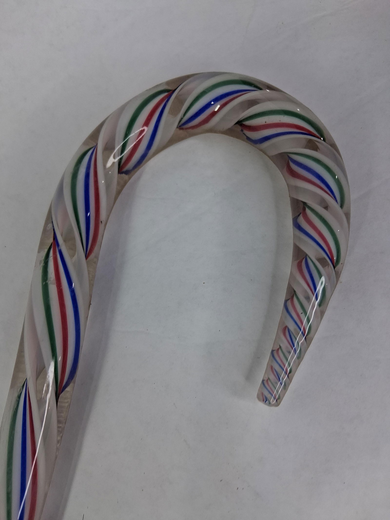 Hand Shaped Twisted Glass Walking Cane: A nice colored glass stripe twisted throughout middle of cane. Bottom tip shows a chip/ 44 inches 