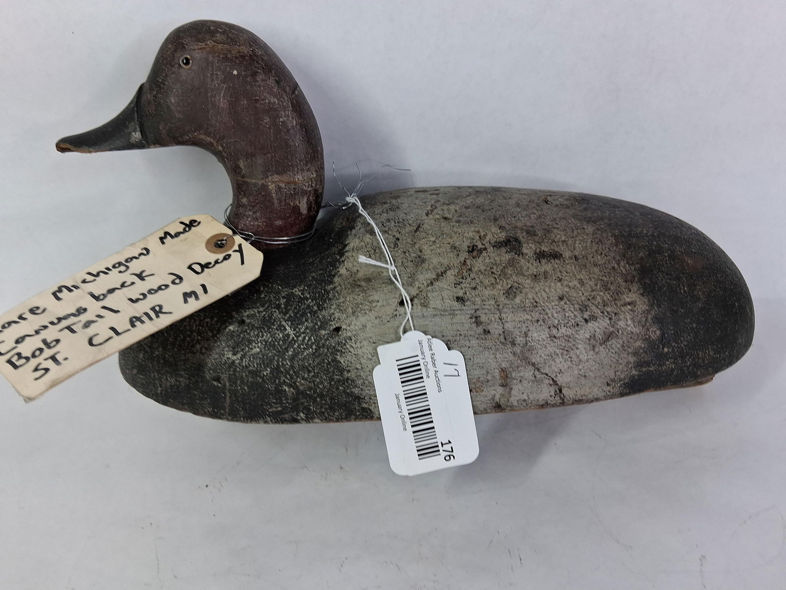 Rare Michigan Made Canvas Back Bobtail Duck Decoy: St. Clair Michagan. With glass eyes and a wooden body. Great primitive paint. 16 inches long