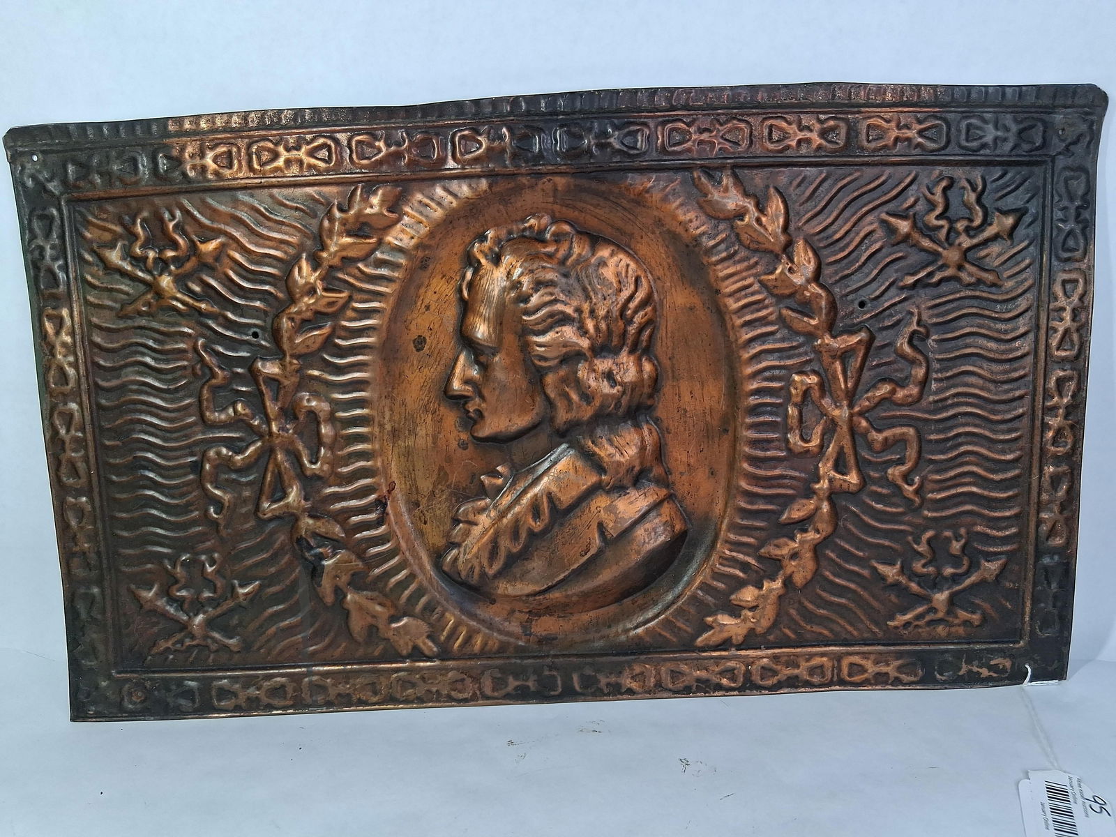 Embossed Copper Panel: Napoleon or presidential figure to center with a wreath pattern. 24.5 x 14
