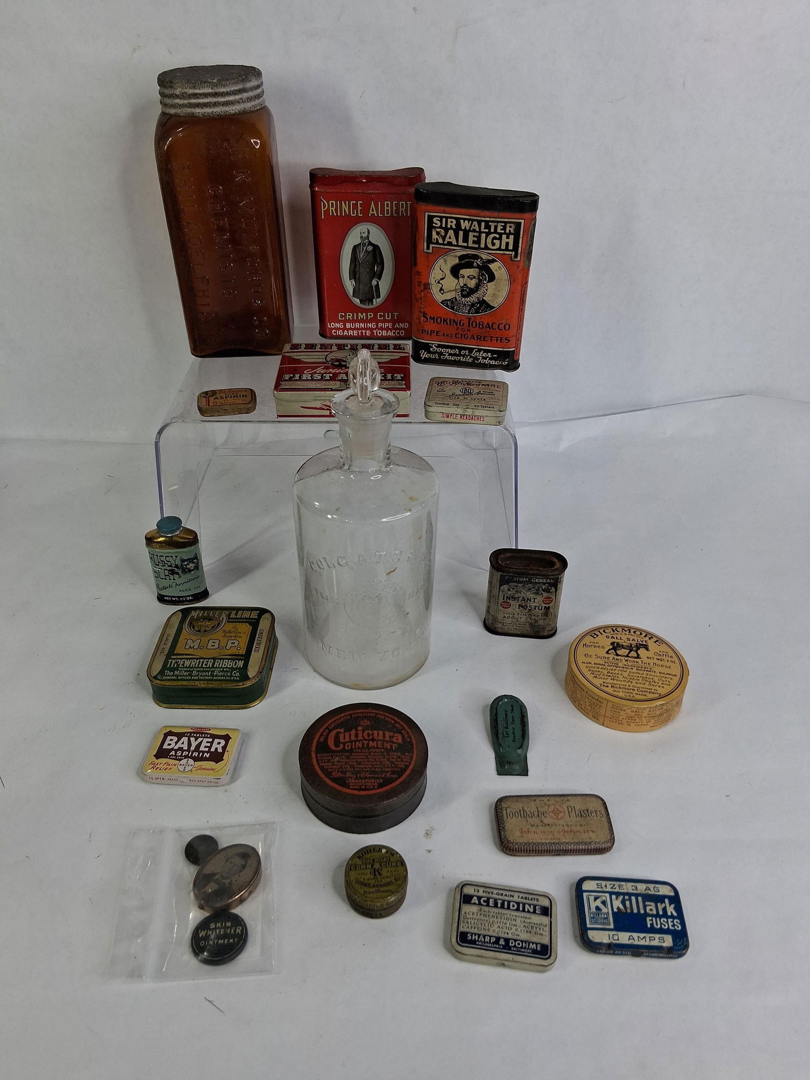 Large Lot of Pharmaceutical, Apothecary, Tobacco and Advertising Tins, Bottles and More: Lot includes Prince Albert, Sir Walter Raliegh, Sentinel, Bayer, Cuticura, Bickmore, Pussy Scat, Sr. Sauers, H.K. Mulford & Co. Chemist Bottle, Colgate and Co. Glass Apothecary Bottle w/ Stopper, 