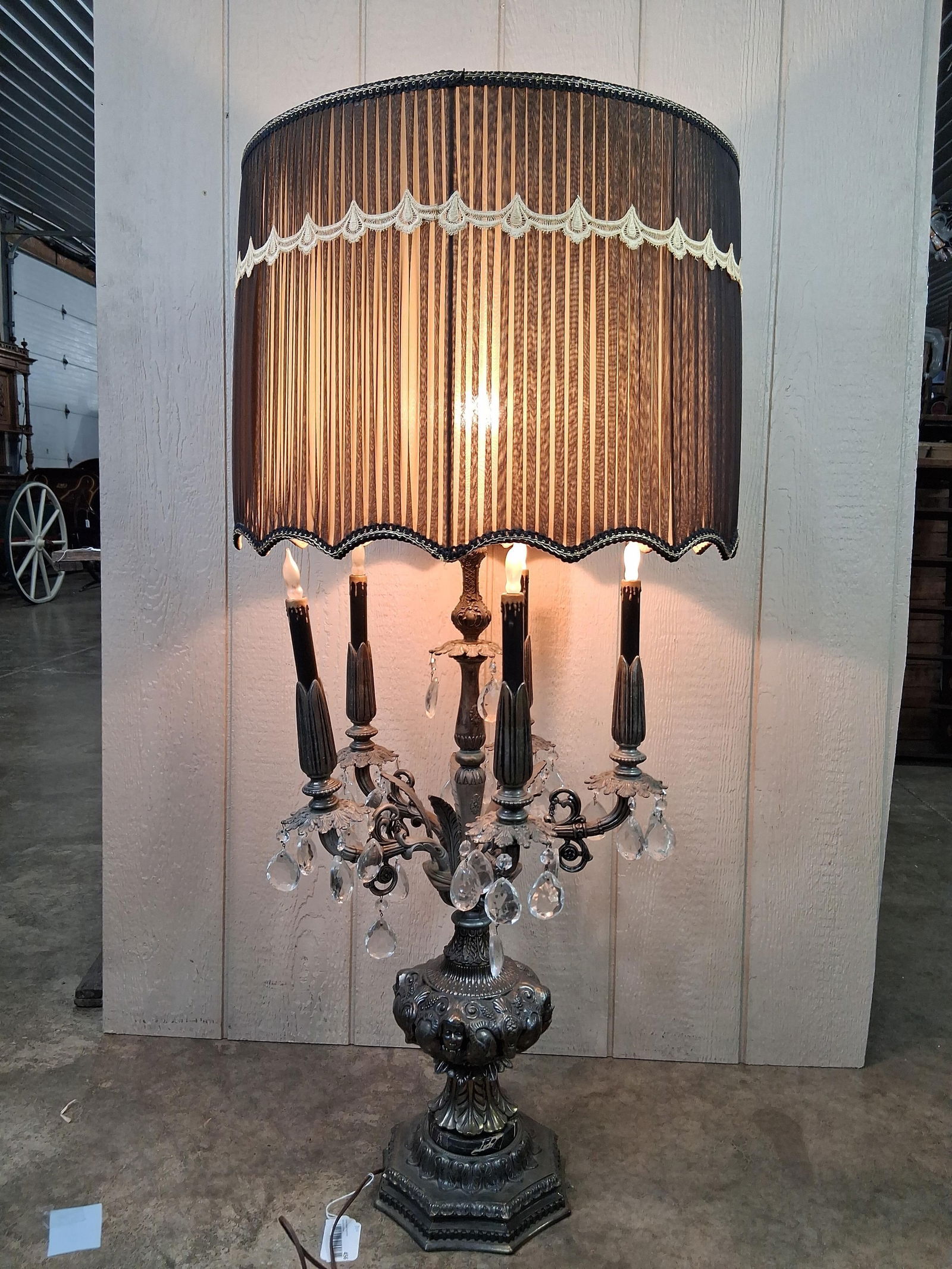 Impressive Crystal & Cherub Face Parlor Lamp: Metal body with a marble base and crystal prisms. Working condition. 47 inches tall 