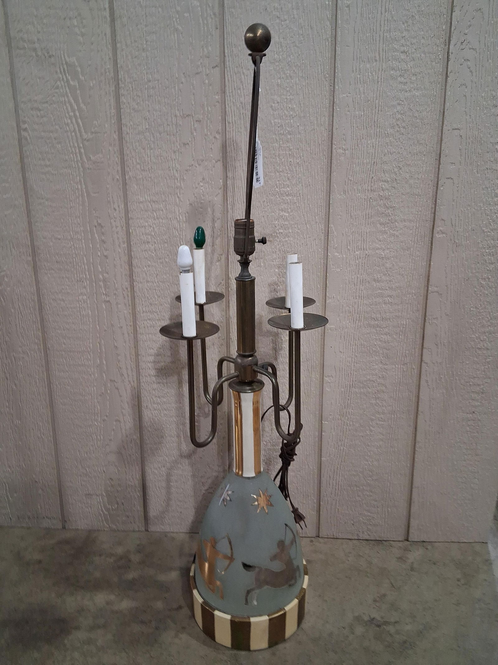 Mid Century Zodiac Sagittarius Table Lamp: Bottom glass base features centaur figures, with a high brass 4 globe top. No shade. 40 inches tall 