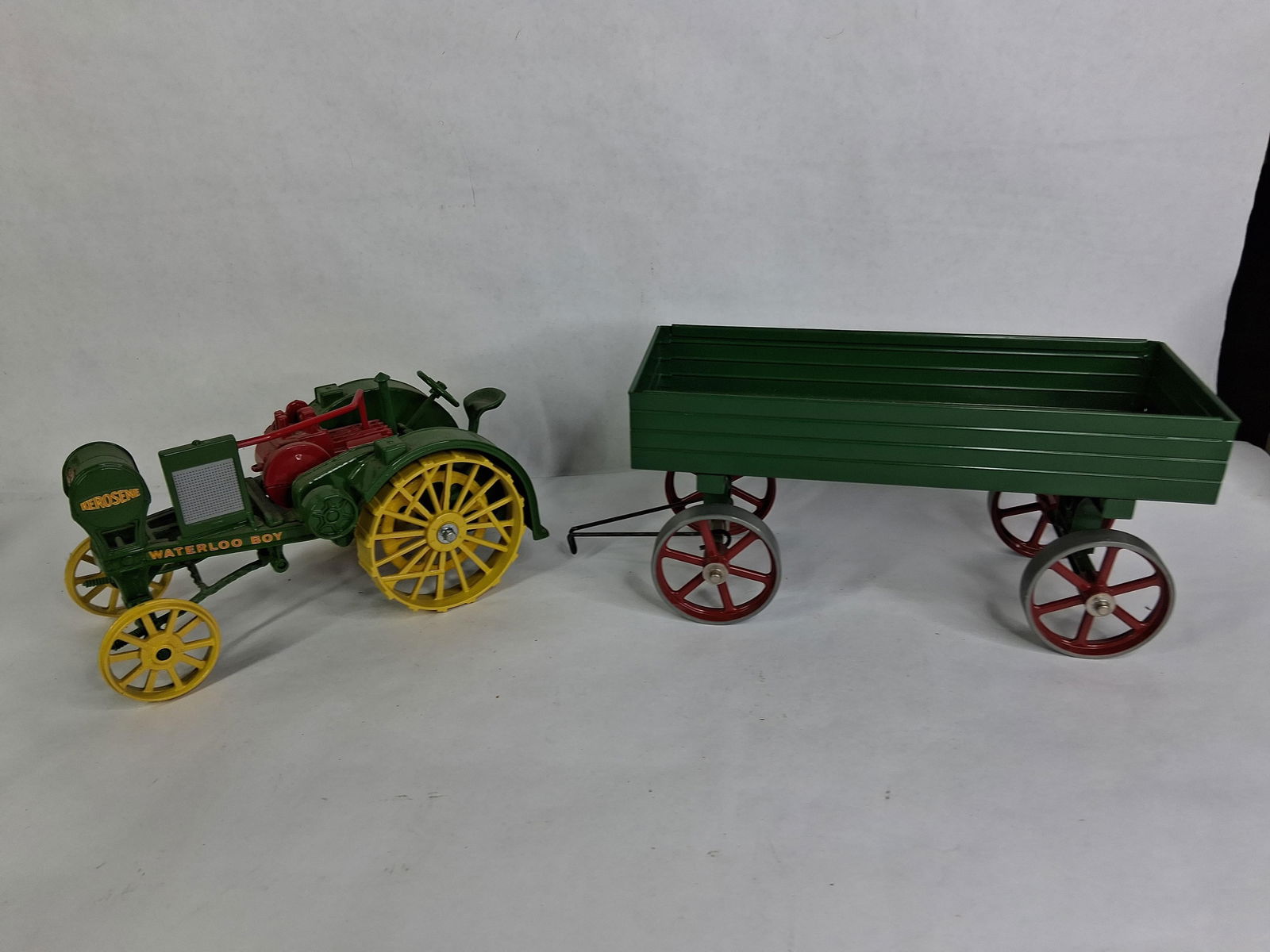 Ertl John Deere Waterloo Boy Kerosene Steel Wheel Tractor w/ Mando Farm Wagon: This great scale model farm toy lot is sure to please with both being 1/16 scale and in good overall open box condition? ?