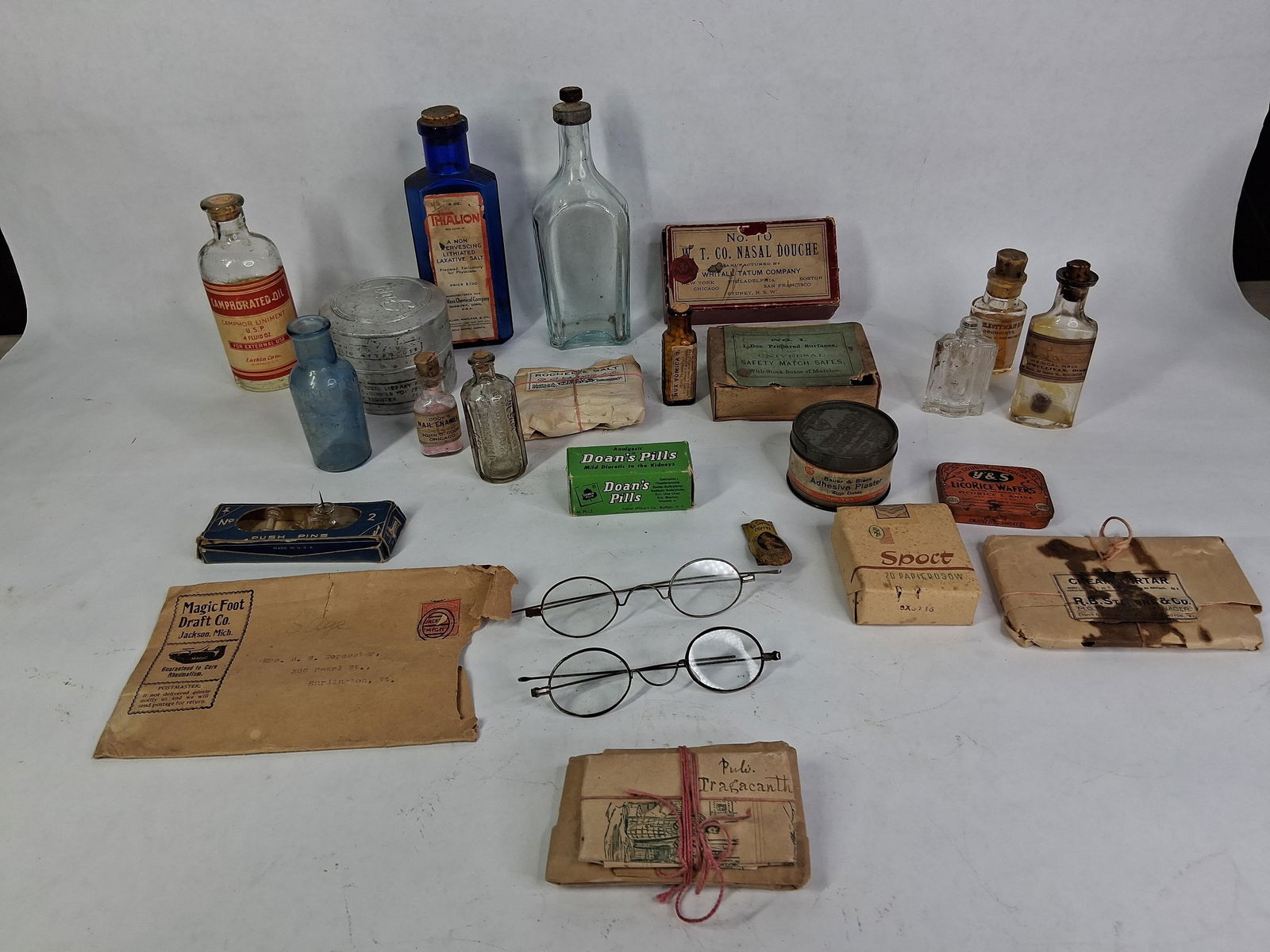 Medicinal Glass Bottles, Wire Rim Glasses, and Tins: Household elixers and tins. 