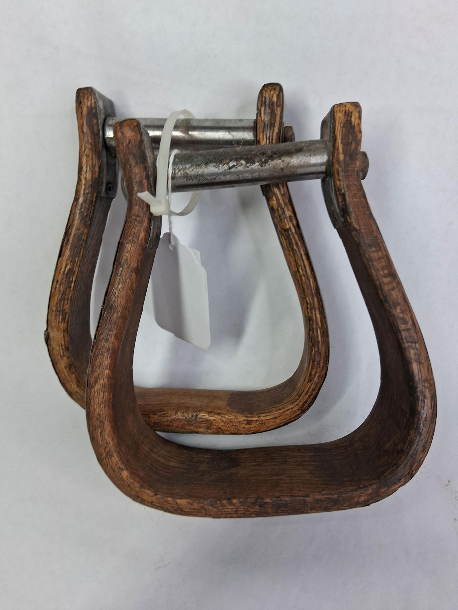 Old Wooden Stirrups: Wooden with tin lining and metal attachments. 