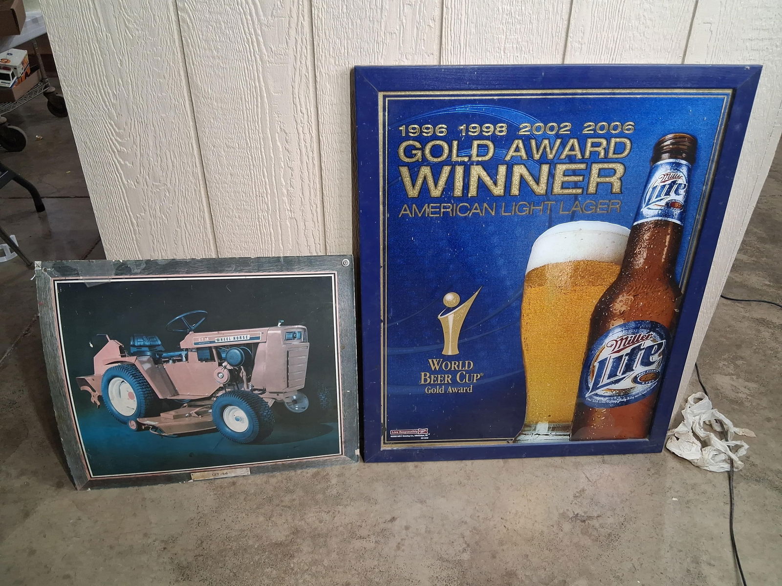 SS Framed Miller Lite World Beer Cup Sign & SS Masonite GT 14 Tractor Sign Self Framed: showing areas of wear due to age and usage 