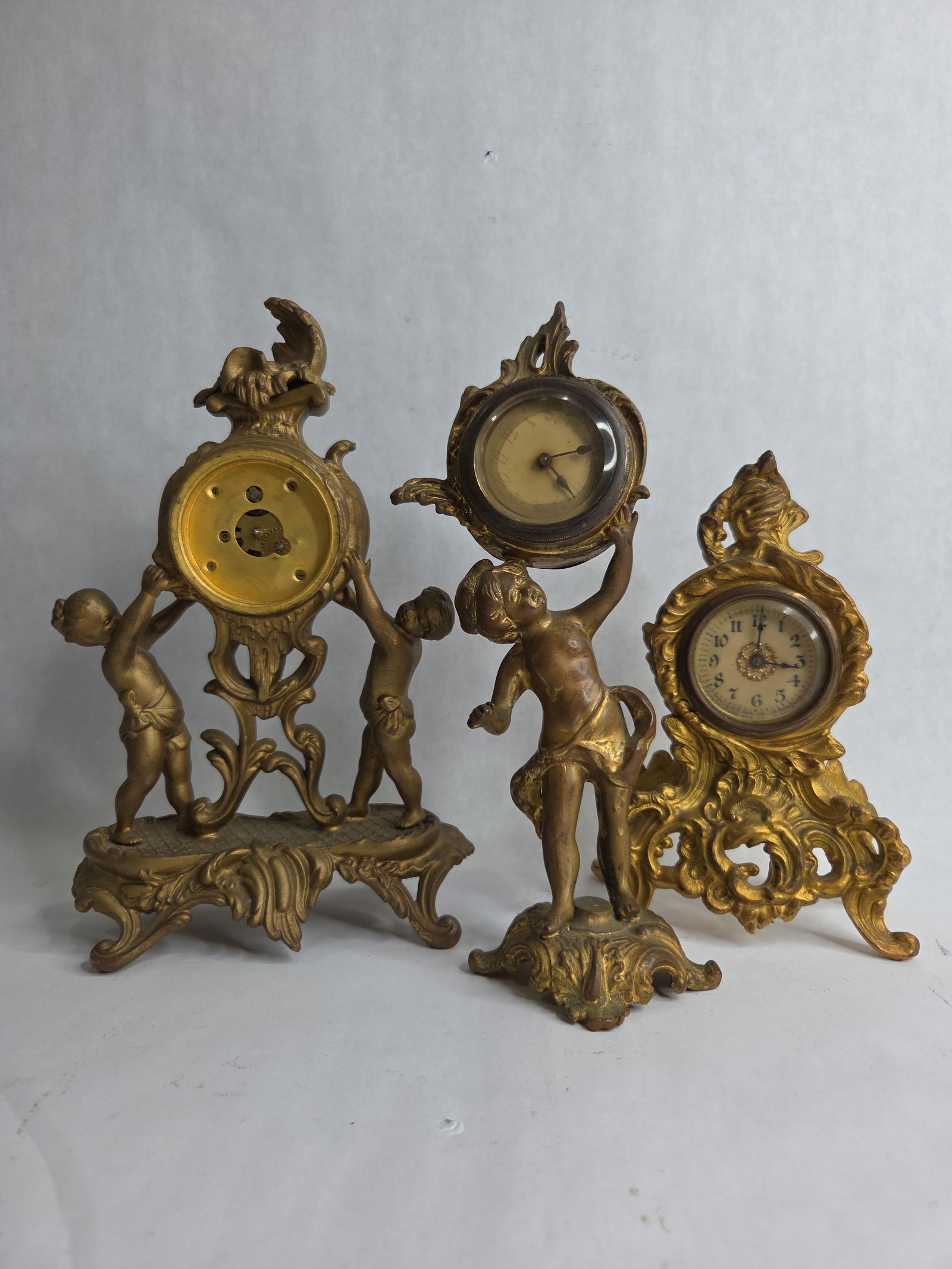 New Haven Criterion Gilt Metal Figural Mantel Time Pieces Featuring Two Putti (1 of 9)