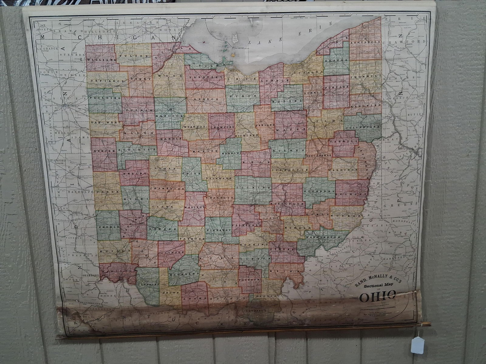 1898-1900 CR Vinyl Rand McNally & Co. Sectional Map of Ohio on Wooden Reel: Great early condition showing wear and water damage to open parts with soiling showing with map being fully intact on vinyl 55 in. W