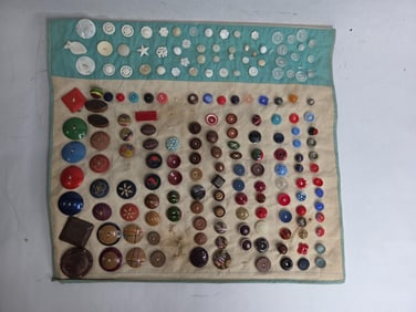 Early Button Displays on Fabric Inc. Various Size, Color and Shape Buttons