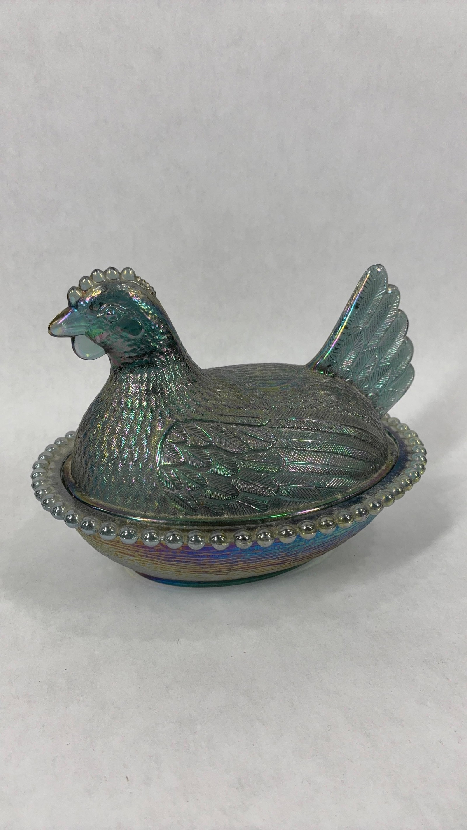 Indiana Glass Carnival Iridescent Glass Hen on Nest Covered Dish: Showing very minor flaking around edges unable to see with hen and dish measuring 7.5 in. l