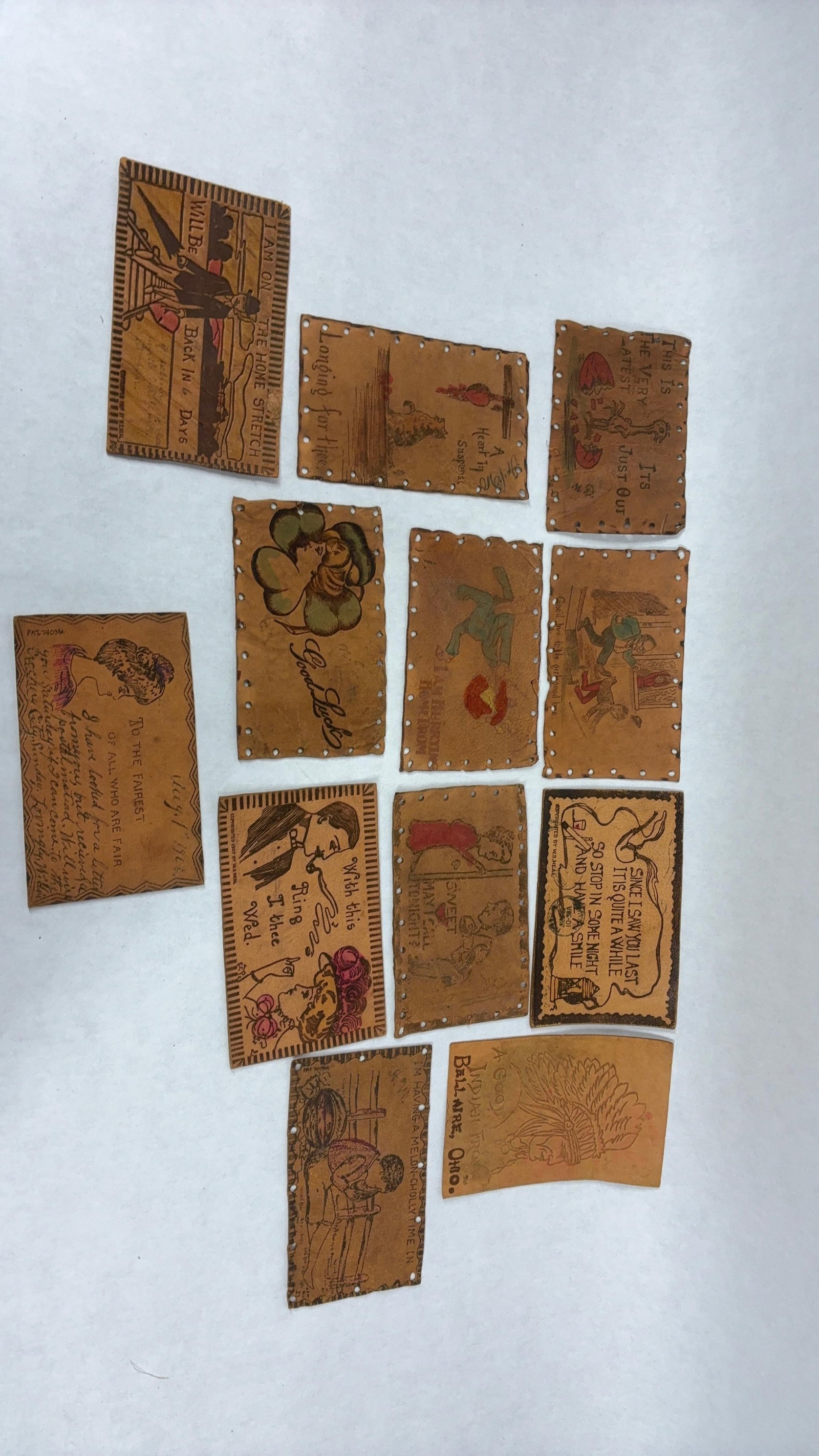 Early 1900's Leather Post Cards Inc. Postmarked Lot of 12: this great early lot of leather post cards showing great graphics would make a great addition to any collection