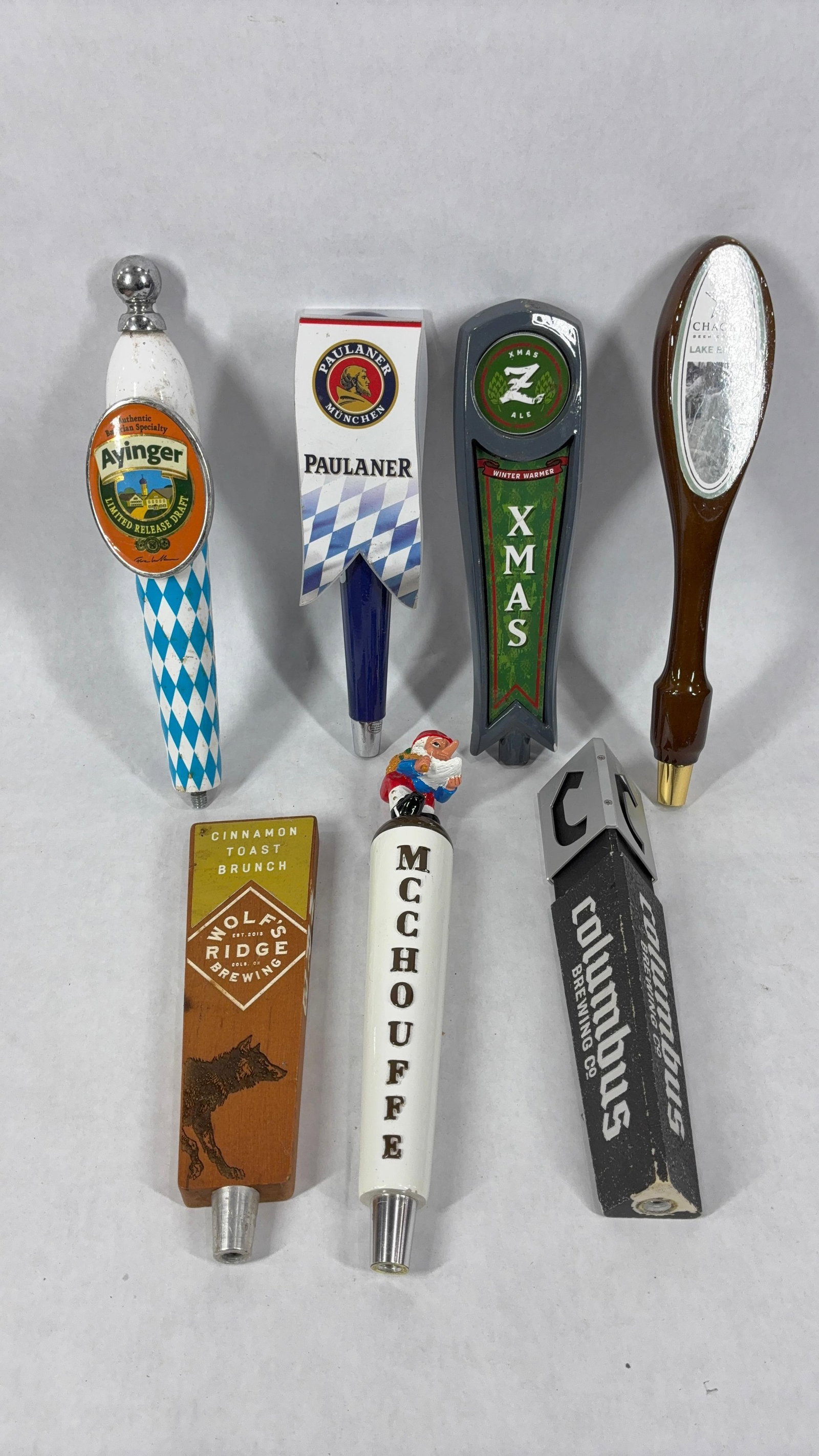 Assorted Bar Beer Taps Inc. 7 Various Taps: This great bar beer tap lot includes Columbus Brewing Co., Chagrin Lake Effect, McChouffe, Wolfs Ridge, Xmas Ale, Paulaner, Ayinger