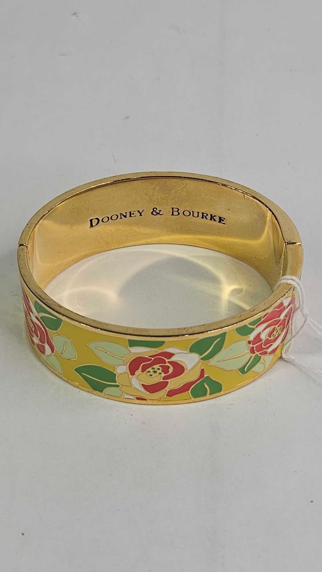 Dooney & Bourke Rosette Garden Bracelet: Clamper bracelet in yellow heat set enamel. Approx 3 inches diameter with a colorful rose patterned enamel design. Good condition.