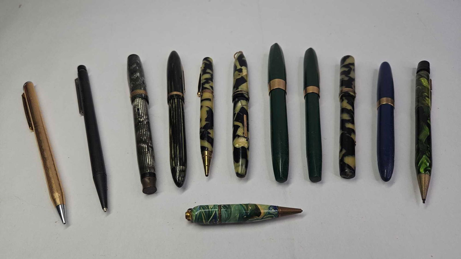 Early Fountain Pens & Mechanical Pencils: National Pen Co, Eversharp, Sheaffer, and more. Several featured 14K gold tips or gold plated parts.