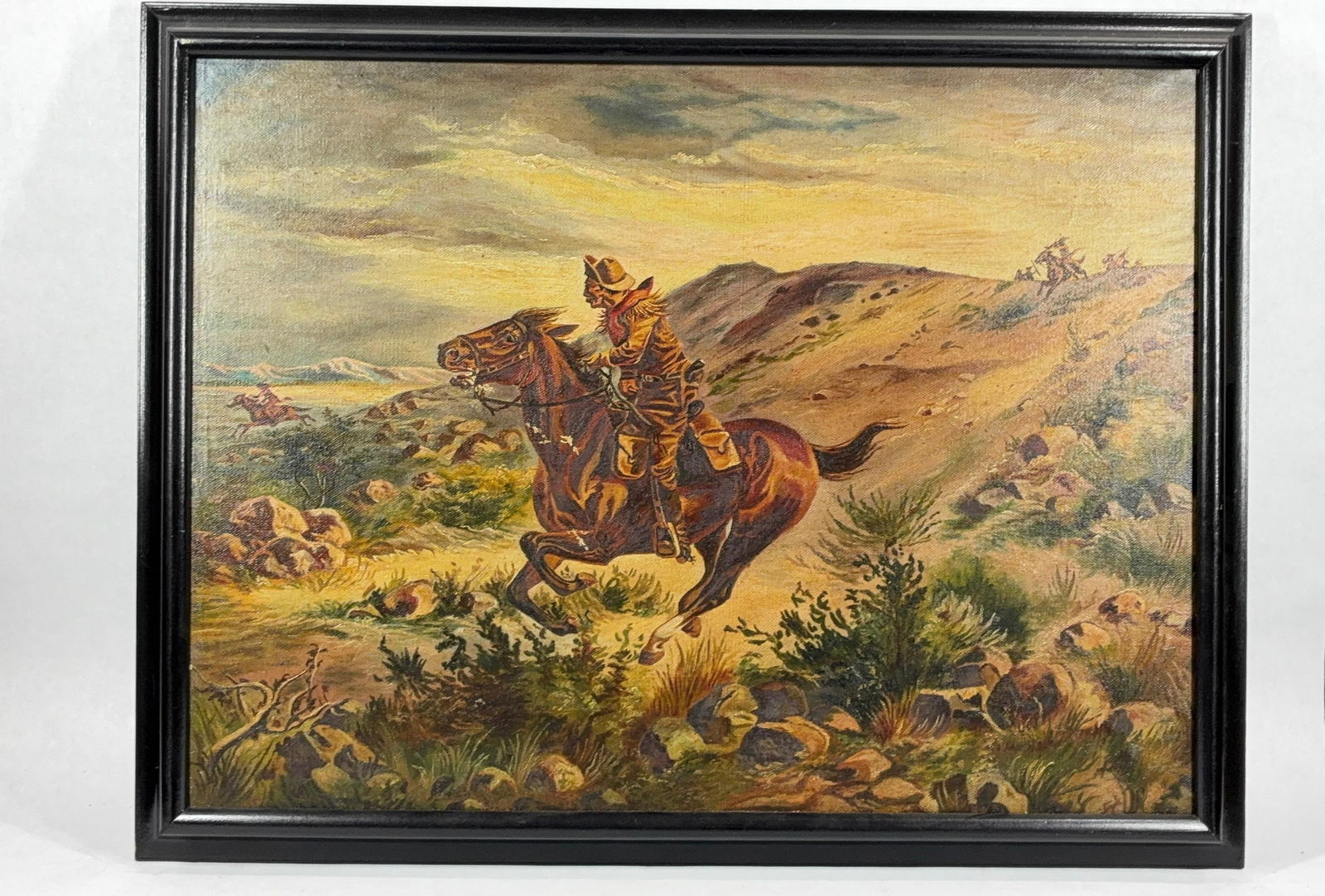 Western Cowboy & Indian Oil on Canvas Painting: A dynamic Western scene with a cowboy riding a horse and Native Americans in the landscape. No artist signature was found but could be a western artist such as Henry H Cross or similar. 27x21