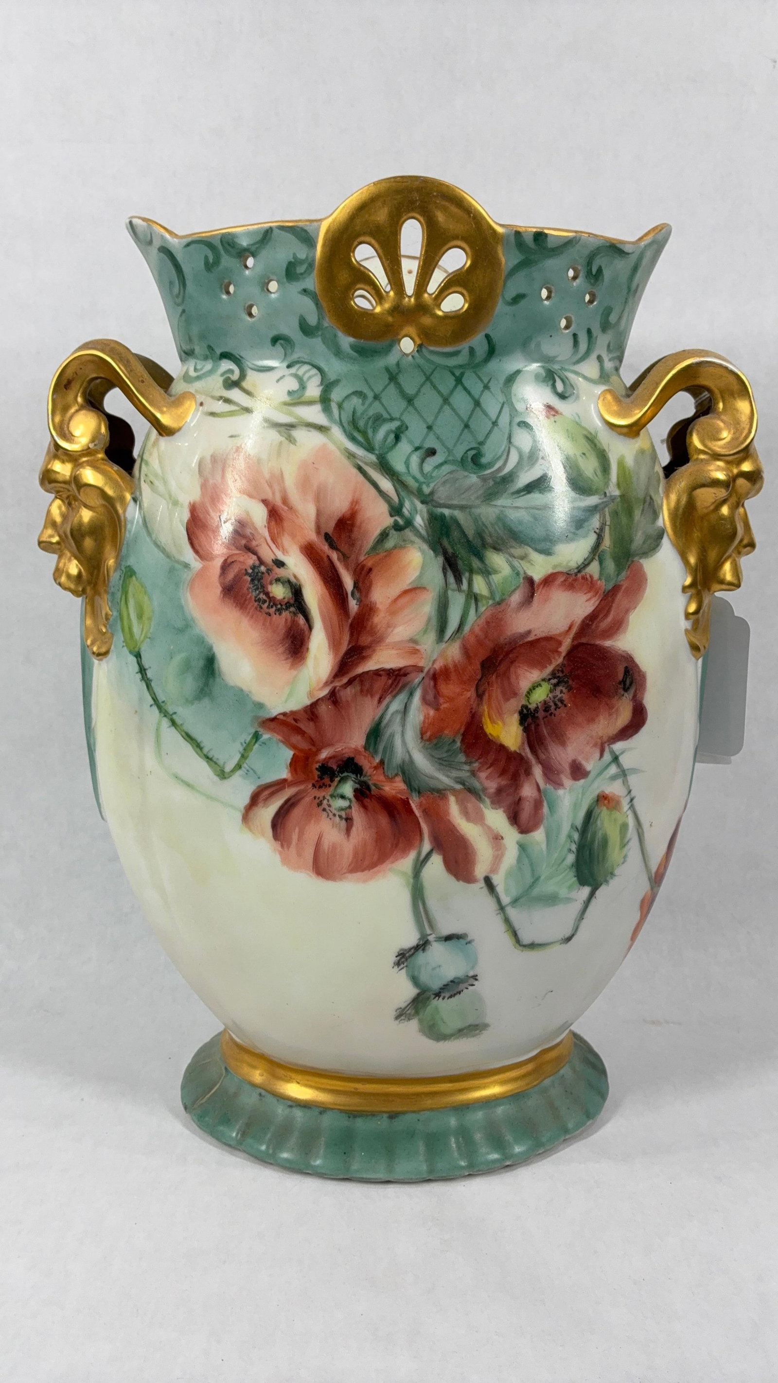 Mythical Hand Painted Pillow Vase: Detail poppy painted flowers with gold toned Mythical figure handles. No chips or cracks. 13x11x4.5. N 85 stamped to bottom edge.