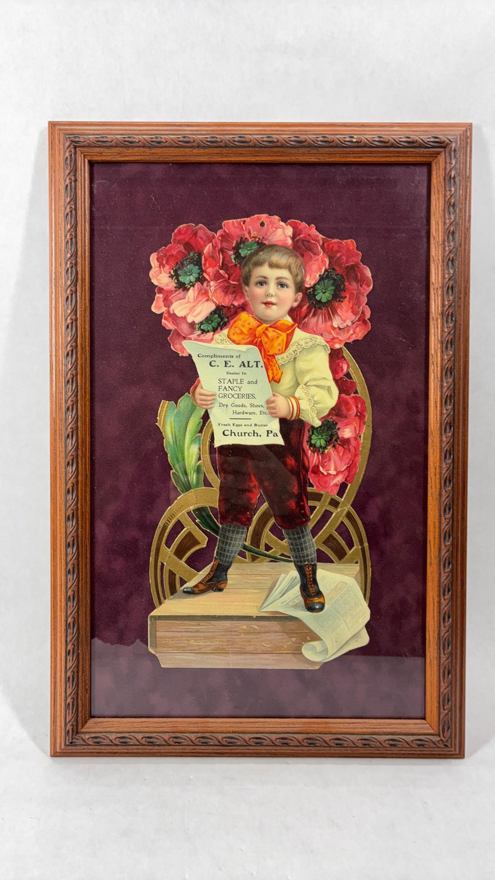 Staple & Fancy Groceries 20th Century Advertising Litho: Church, Pa. die cut cardboard ad. small area to the bottom left show a crinkle and some staple holes along bottom. otherwise great color and condition. Oak frame is 19x12.5