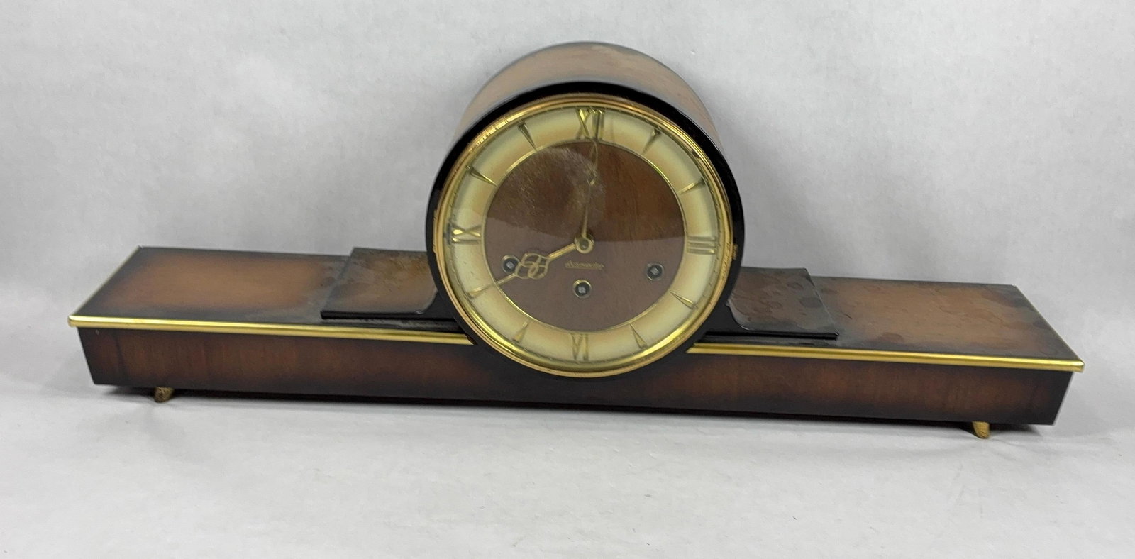1950s German Westminster Anker Chiming Mantel Clock: Black forest wood body, with original instruction manual. Good working condition but does not include key. 26 inches long.