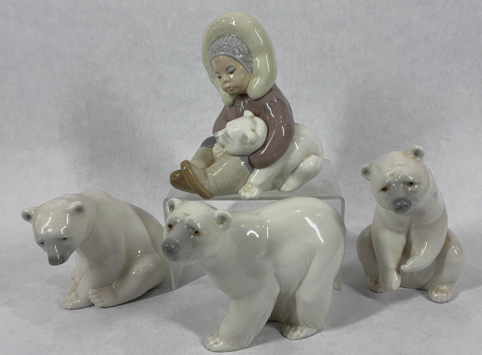 Lladro Polar Bear and Eskimo Porcelain Figures: Each piece is in good condition and signed by artist on bottom. Ranging from 3 to 4.5 inches tall